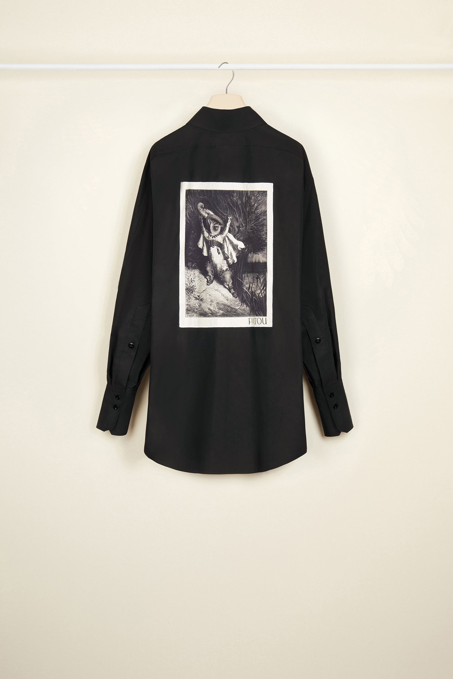 Patou - Mini shirt dress in organic cotton - Black - Layered or on its own, a new shape to make your own.Black organic cotton poplin shirt dress. Short length. Loose silhouette. Shirt collar. Concealed button fastening with JP engraved buttons. Patou logo embroidered at the front. Signature curved seam at the back. Buttoned cuffs.