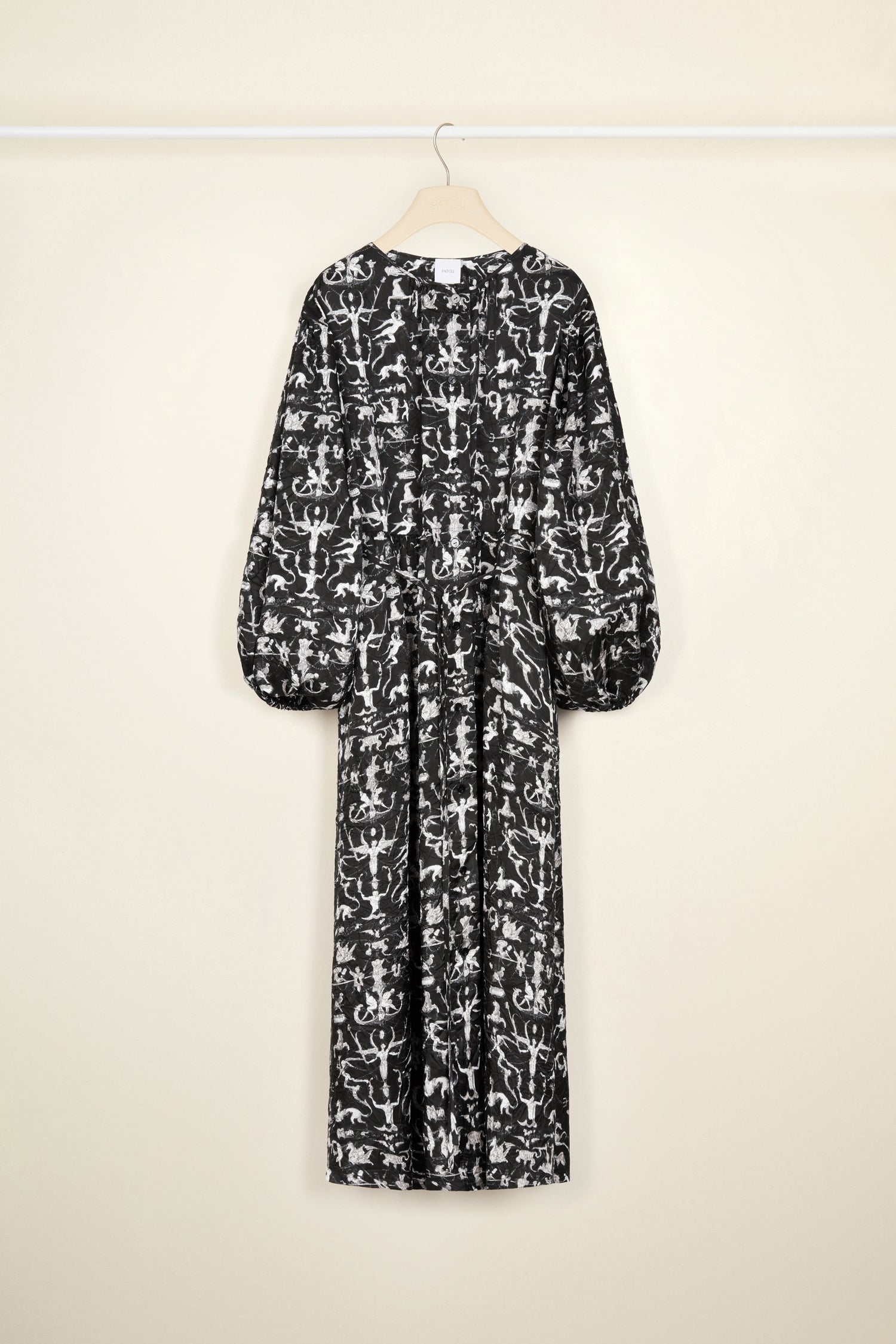 Patou - Maxi shirt dress in printed eco twill satin - Black Fairy Tales - Black eco twill satin dress featuring the seasonal "Fairy Tales" print. Maxi length. Oversized silhouette. Round neckline. High volume sleeves with elasticated cuffs. Button fastening down the front with JP engraved buttons. Thin fabric belt at the waist to adjust the silhouette.