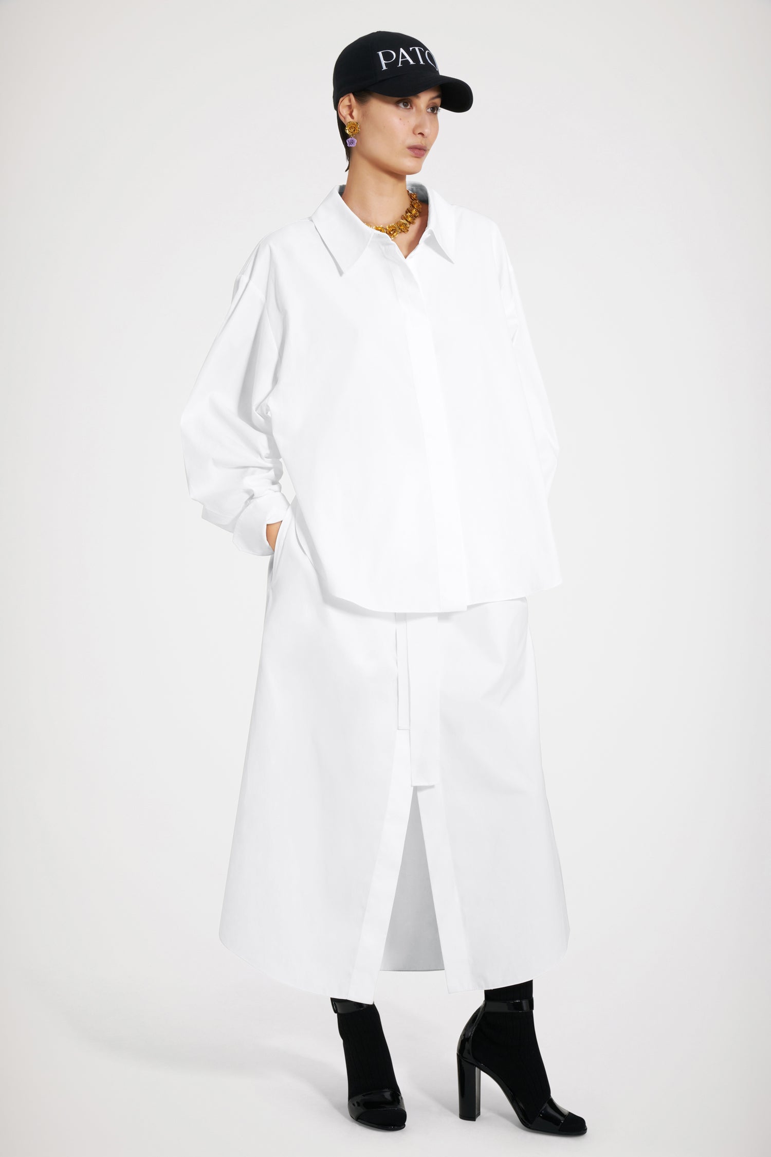 Patou - Two-part dress in organic cotton - White - A Patou trompe-l'oeil that is sweet on the eye.White organic cotton dress. Maxi length. Full silhouette. Trompe-l'oeil design with shirt at the top and buttoned skirt at the bottom; attached at the back. Concealed button fastening. Volume sleeves with buttoned cuffs. Drawstring waist with self-tie grosgrain belt at the front. Pockets at the sides.Loose fit (select one size down for a fitted look).