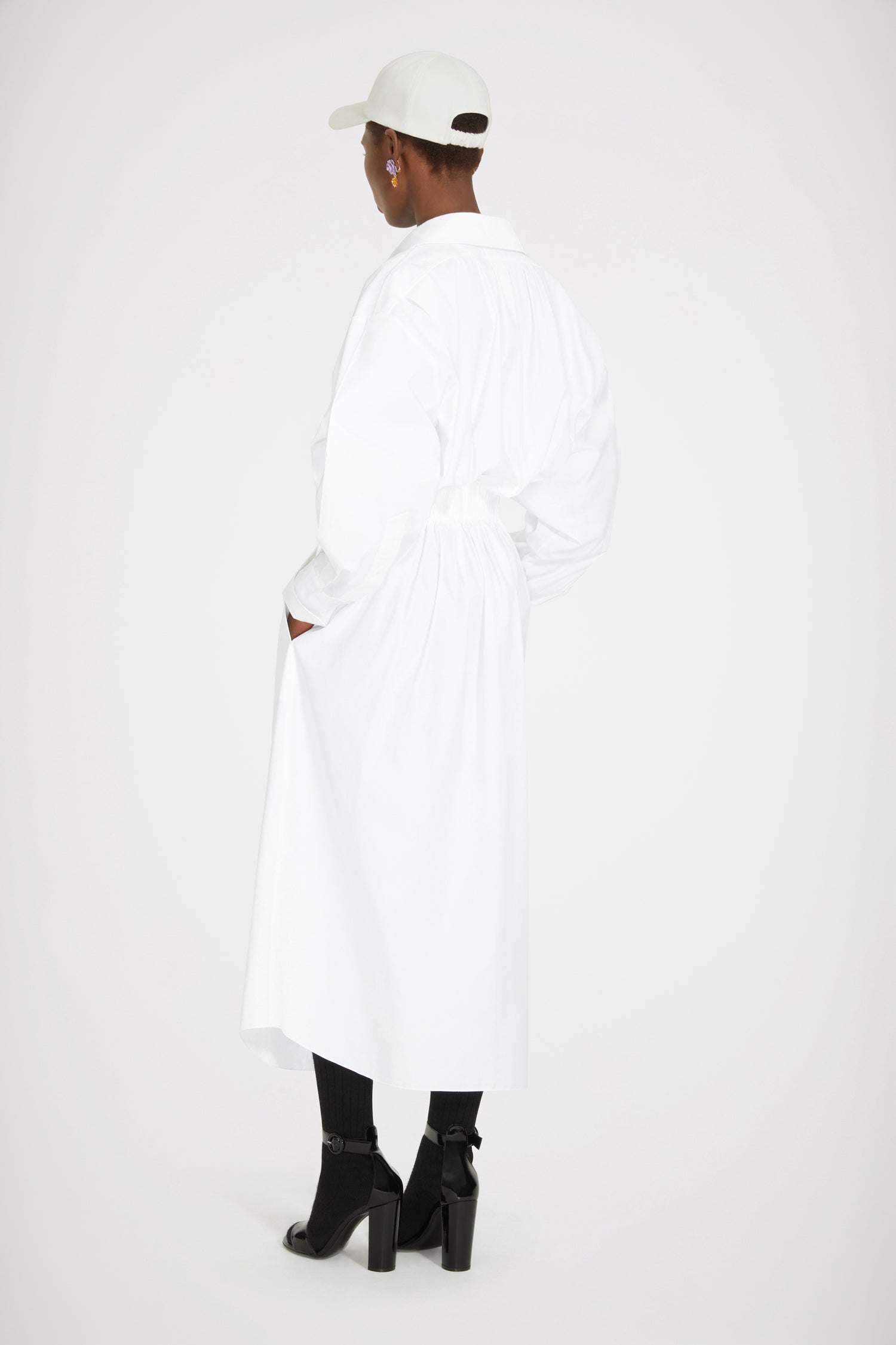 Patou - Two-part dress in organic cotton - White - A Patou trompe-l'oeil that is sweet on the eye.White organic cotton dress. Maxi length. Full silhouette. Trompe-l'oeil design with shirt at the top and buttoned skirt at the bottom; attached at the back. Concealed button fastening. Volume sleeves with buttoned cuffs. Drawstring waist with self-tie grosgrain belt at the front. Pockets at the sides.Loose fit (select one size down for a fitted look).