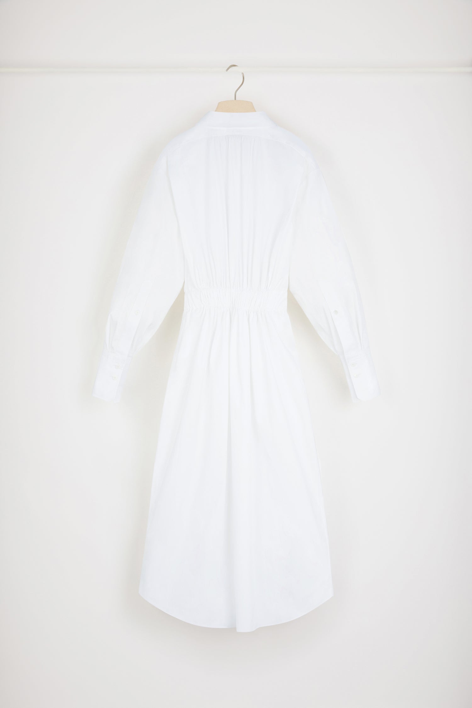 Patou - Two-part dress in organic cotton - White - A Patou trompe-l'oeil that is sweet on the eye.White organic cotton dress. Maxi length. Full silhouette. Trompe-l'oeil design with shirt at the top and buttoned skirt at the bottom; attached at the back. Concealed button fastening. Volume sleeves with buttoned cuffs. Drawstring waist with self-tie grosgrain belt at the front. Pockets at the sides.Loose fit (select one size down for a fitted look).