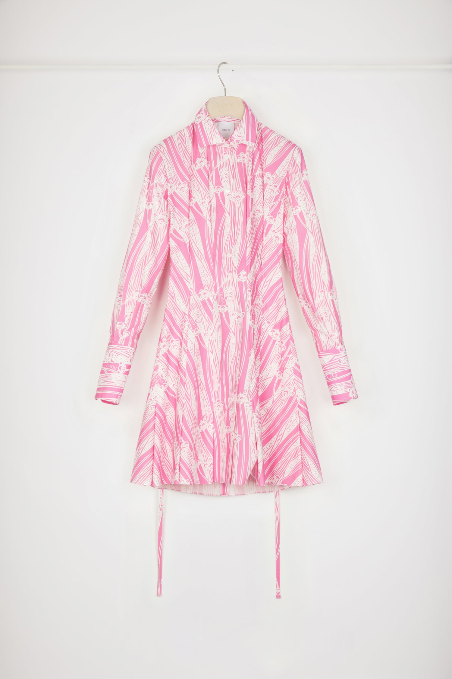Patou - Pleated shirt dress in printed organic cotton - Art Deco Pink - Cut-outs and pleats make for graceful summertime sculptures.Pink organic cotton shirt dress. Art Deco print. Fitted silhouette. Wide pleats on the front bodice and skirt. Button fastening at the front. Drawstring waist with cut-out at the back and belt at the waist. Zip fastening at the back of the skirt. Wide buttoned cuffs.Fitted at the waist.