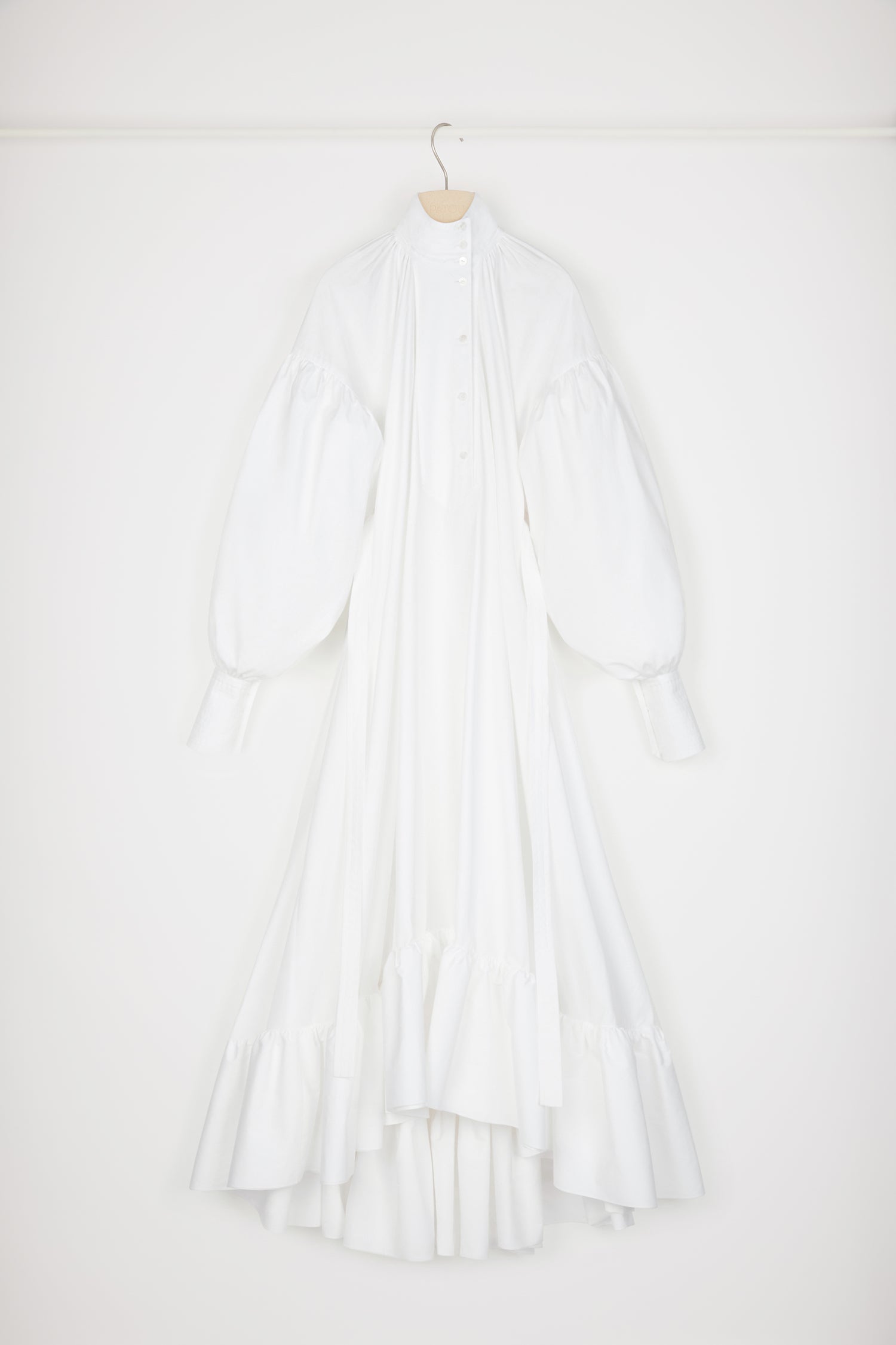 Patou - Maxi tiered dress in organic cotton - White - Enchanting volumes are Patou's love language.White organic cotton poplin dress. Maxi length. Tiered construction. Asymmetric silhouette that is longer at the back. High neck with off-centre button fastening at the front. Ruching at the collar to create pleating at the bodice. High-volume sleeves with dropped shoulders and wide buttoned cuffs. Belt at the waist. Pockets at the sides.This cut is oversized but we advise you to take your usual size.