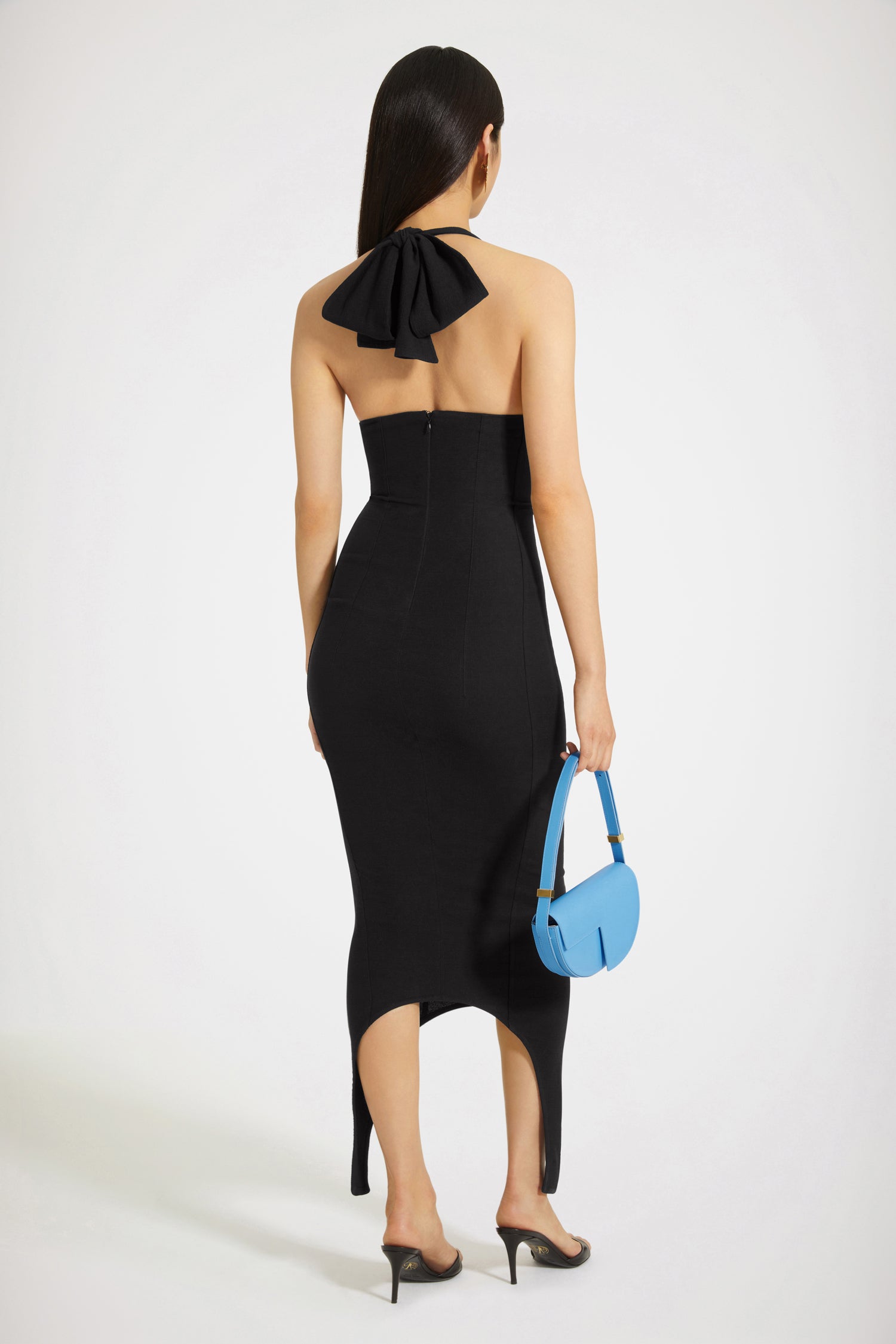 Patou - Halterneck dress in organic stretch seersucker - Black - Infusing the Patou vestiaire with a soupçon of seduction. Black eco-viscose and organic cotton blend dress. Midi length. Fitted style. Halterneck collar with maxi bow at the back. V neckline. Zip fastening at the back. Asymmetric curved hem.Spring-Summer 2023 Show - Look #26