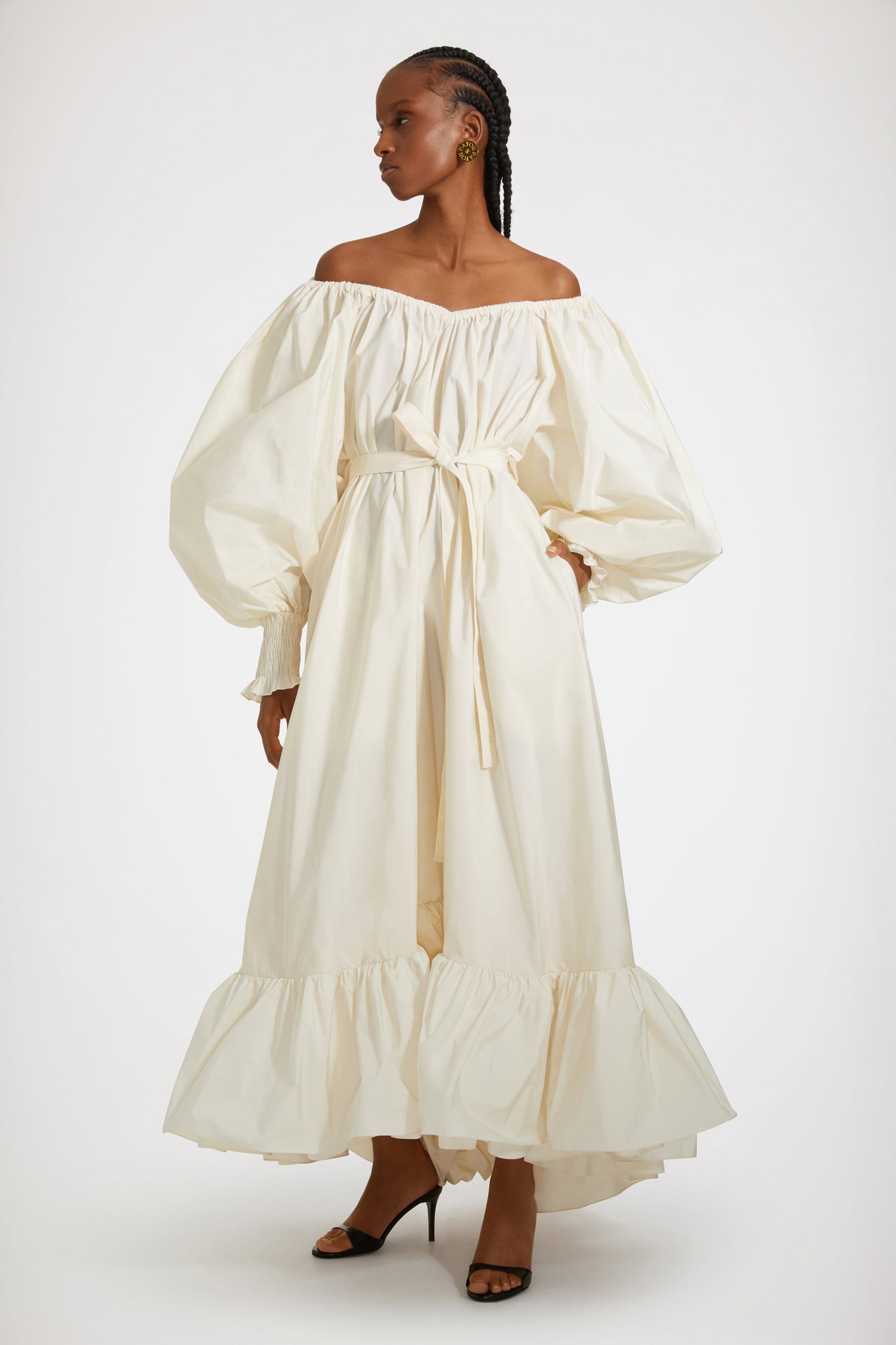 Patou - Maxi cocktail dress in recycled faille - Ivory - An elaborate cocktail of high volume and high spirits.Ivory recycled polyester faille dress. Maxi length. Tiered construction. Asymmetric silhouette that is longer at the back. Elasticated neckline that can be worn off the shoulders. High-volume sleeves with smocked cuffs. Belt at the waist. Pockets at the sides.This cut is oversized but we advise you to take your usual size.Spring-Summer 2023 Show - Look #12