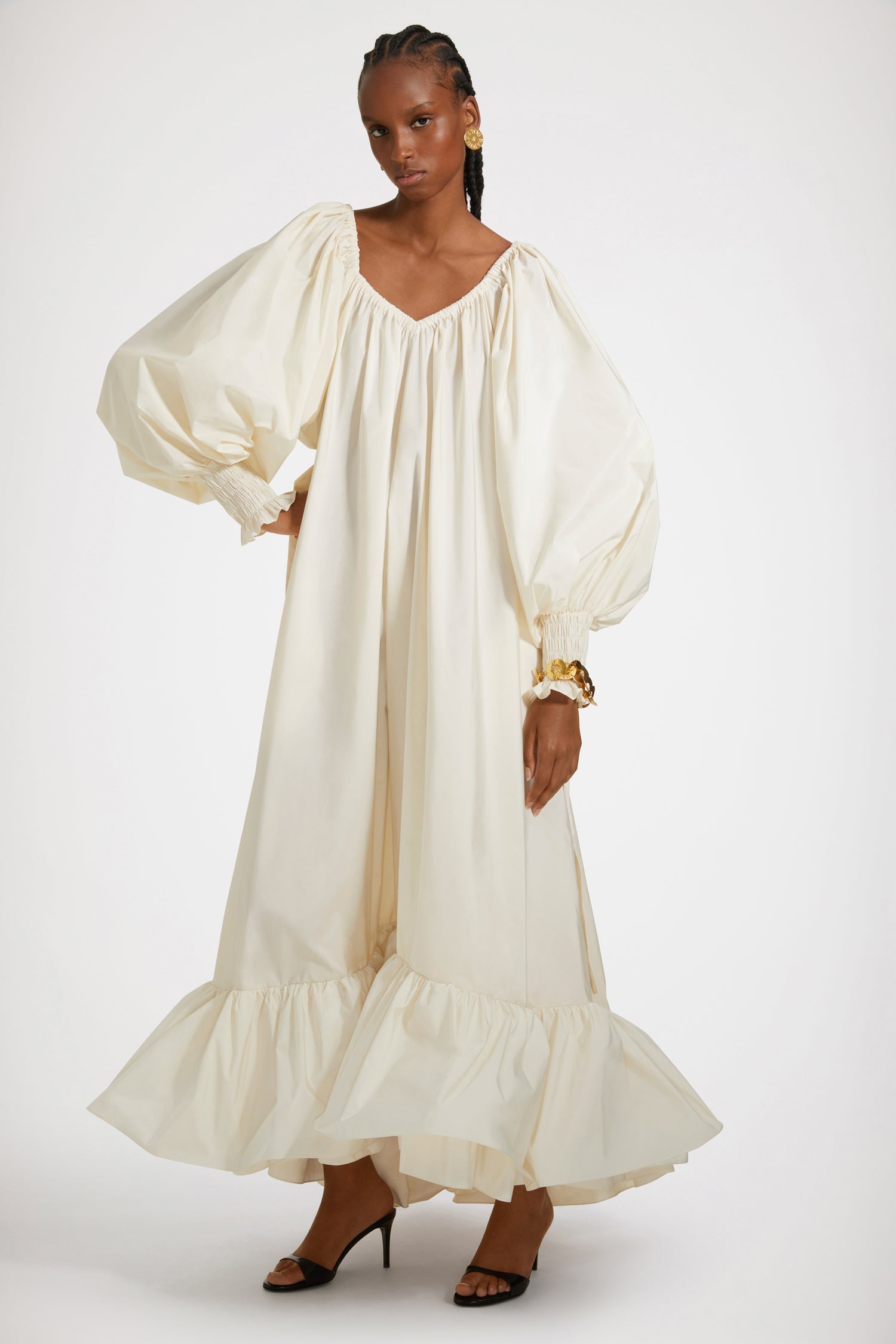 Patou - Maxi cocktail dress in recycled faille - Ivory - An elaborate cocktail of high volume and high spirits.Ivory recycled polyester faille dress. Maxi length. Tiered construction. Asymmetric silhouette that is longer at the back. Elasticated neckline that can be worn off the shoulders. High-volume sleeves with smocked cuffs. Belt at the waist. Pockets at the sides.This cut is oversized but we advise you to take your usual size.Spring-Summer 2023 Show - Look #12