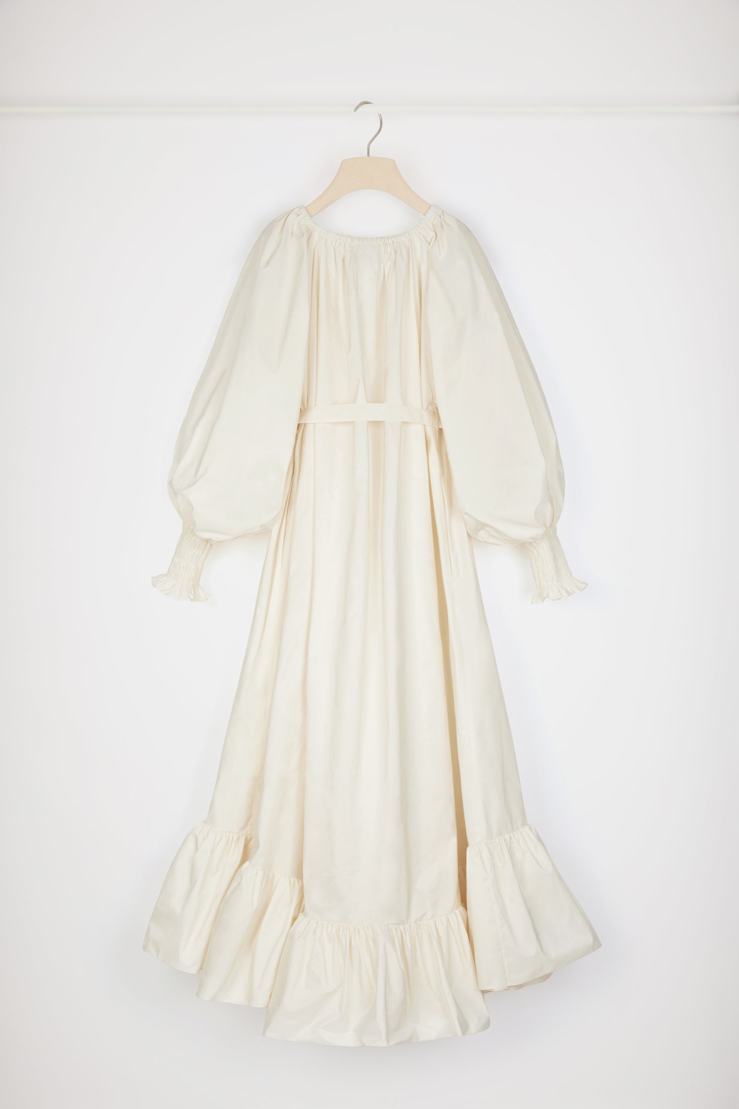 Patou - Maxi cocktail dress in recycled faille - Ivory - An elaborate cocktail of high volume and high spirits.Ivory recycled polyester faille dress. Maxi length. Tiered construction. Asymmetric silhouette that is longer at the back. Elasticated neckline that can be worn off the shoulders. High-volume sleeves with smocked cuffs. Belt at the waist. Pockets at the sides.This cut is oversized but we advise you to take your usual size.Spring-Summer 2023 Show - Look #12