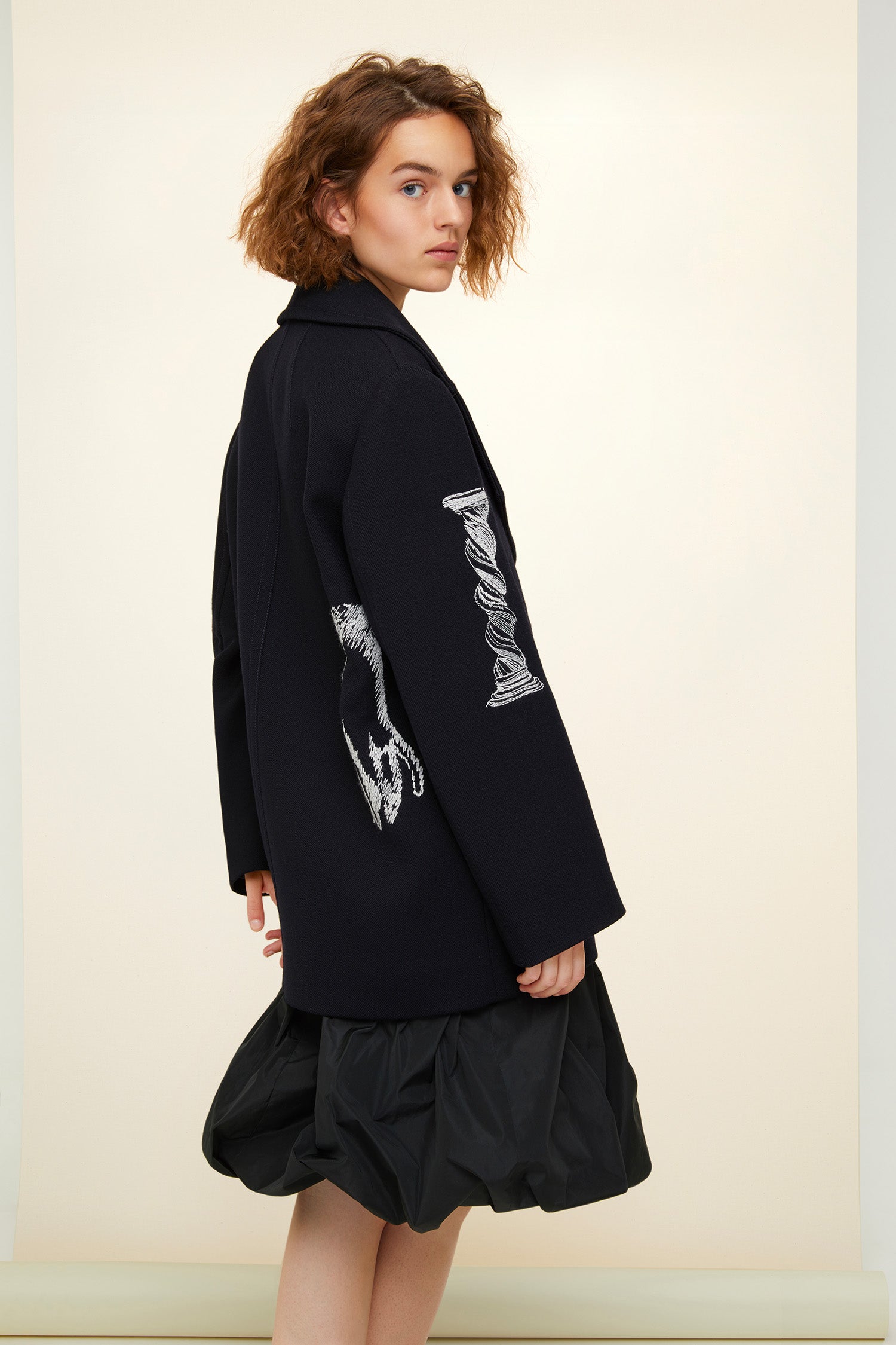 Patou - Oversized embroidered virgin wool peacoat - Navy - A day coat with a touch of fantasy! Navy virgin wool peacoat. Double-breasted style with exaggerated lapels. Embroidered with white Patou heritage motifs (perfume bottle, Greek column). Gold-coloured buttons and gold embroidered logo on the sleeve. Slit pockets at the sides. Fully lined.