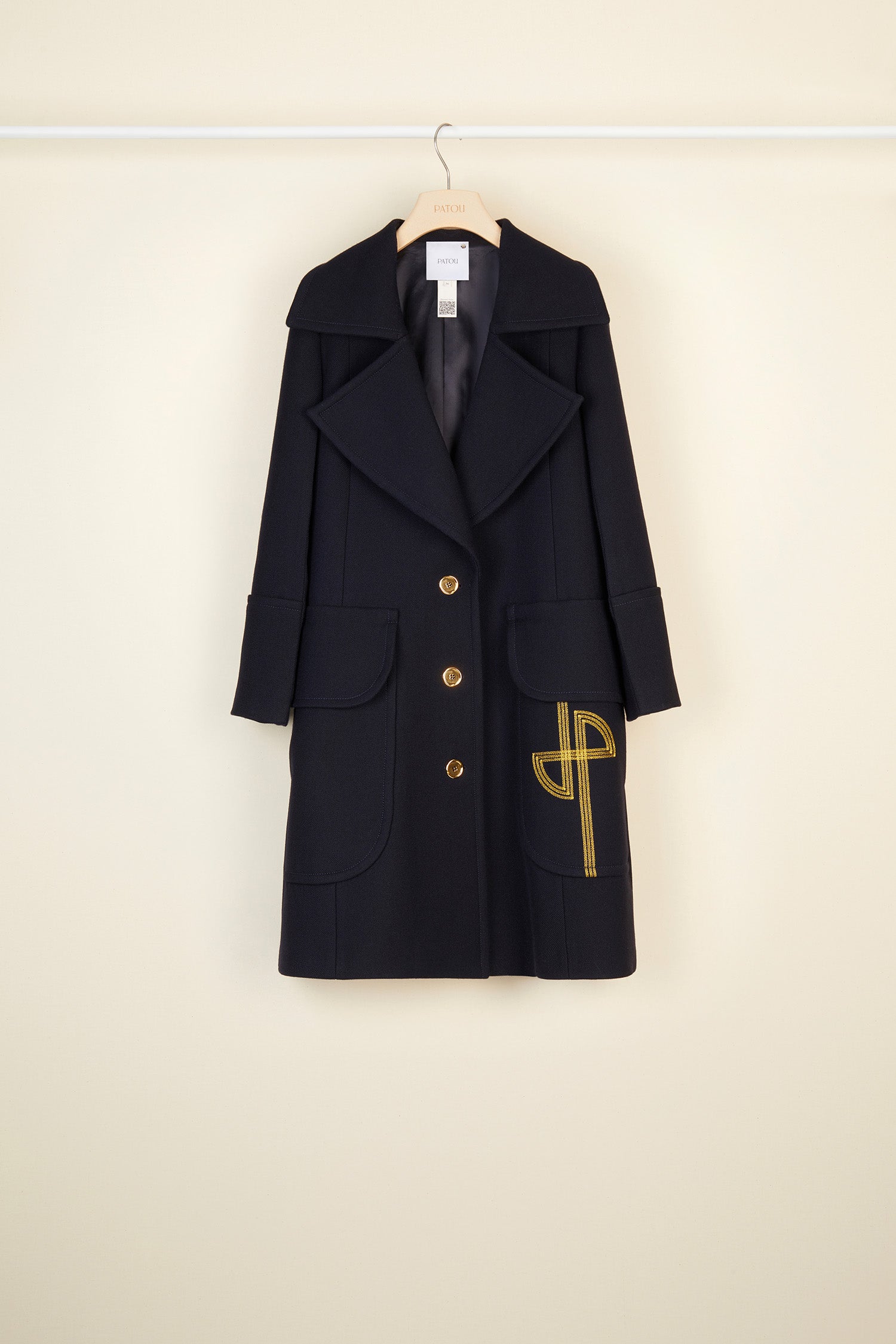 Patou - Longline wool coat with embroidered logo - Navy - Patou puts its stamp on the overcoat.Navy virgin wool longline coat with exaggerated lapels. Gold-coloured buttons and gold embroidered logo at the front. Cuffed sleeves and flap pockets. Fully lined.