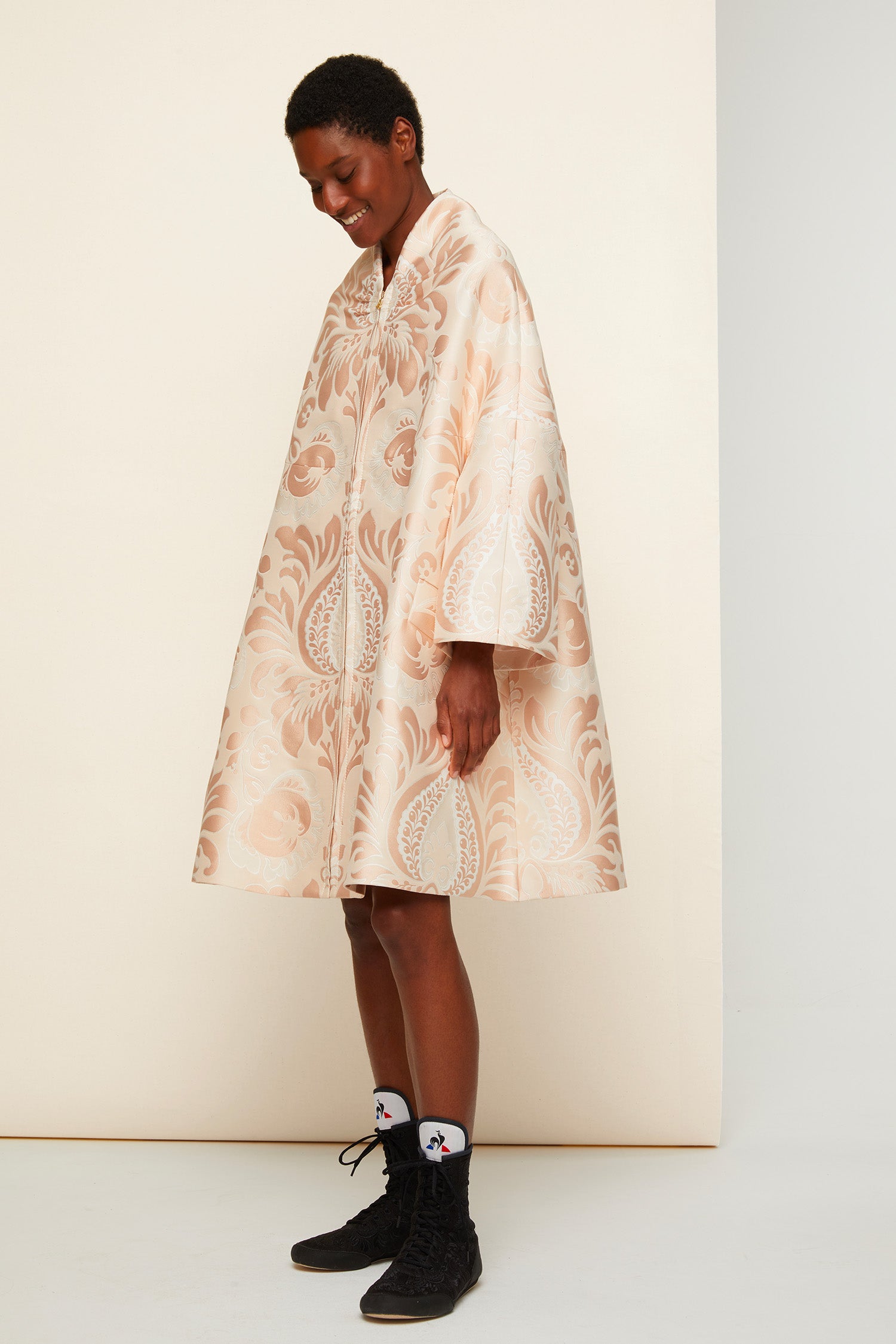 Patou - Oversized floral silk brocade coat - Peach Blossom - Floral brocade blossoms over the cocoon coat. Oversized peach blossom silk brocade coat. Flared silhouette, soft structure. Swan collar with shirred detailing. Engraved gold-coloured zip at the front, two large side pockets. Geometric darts at the back. Fully lined.