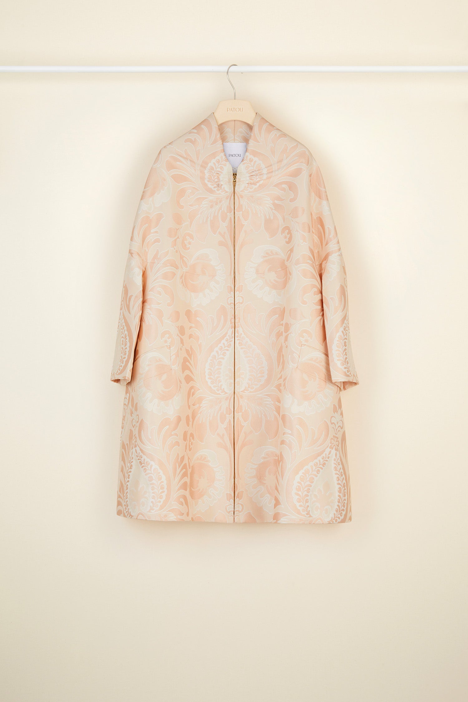 Patou - Oversized floral silk brocade coat - Peach Blossom - Floral brocade blossoms over the cocoon coat. Oversized peach blossom silk brocade coat. Flared silhouette, soft structure. Swan collar with shirred detailing. Engraved gold-coloured zip at the front, two large side pockets. Geometric darts at the back. Fully lined.