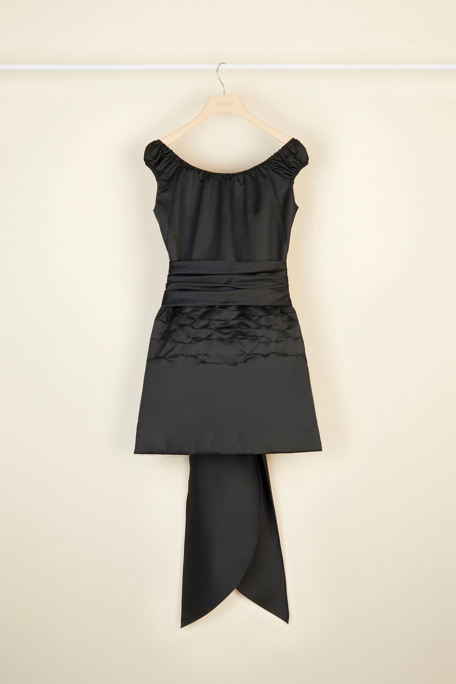 Patou - Cold-shoulder dress with oversized draped panels - Black - The neckline emphasises the shoulders. Black duchesse satin dress. Elasticated neckline that can be worn off the shoulders. Draped panel around the waist that hangs long and loose at the back. Short skirt with shirred detailing. Zip fastening at the back. Fully lined.