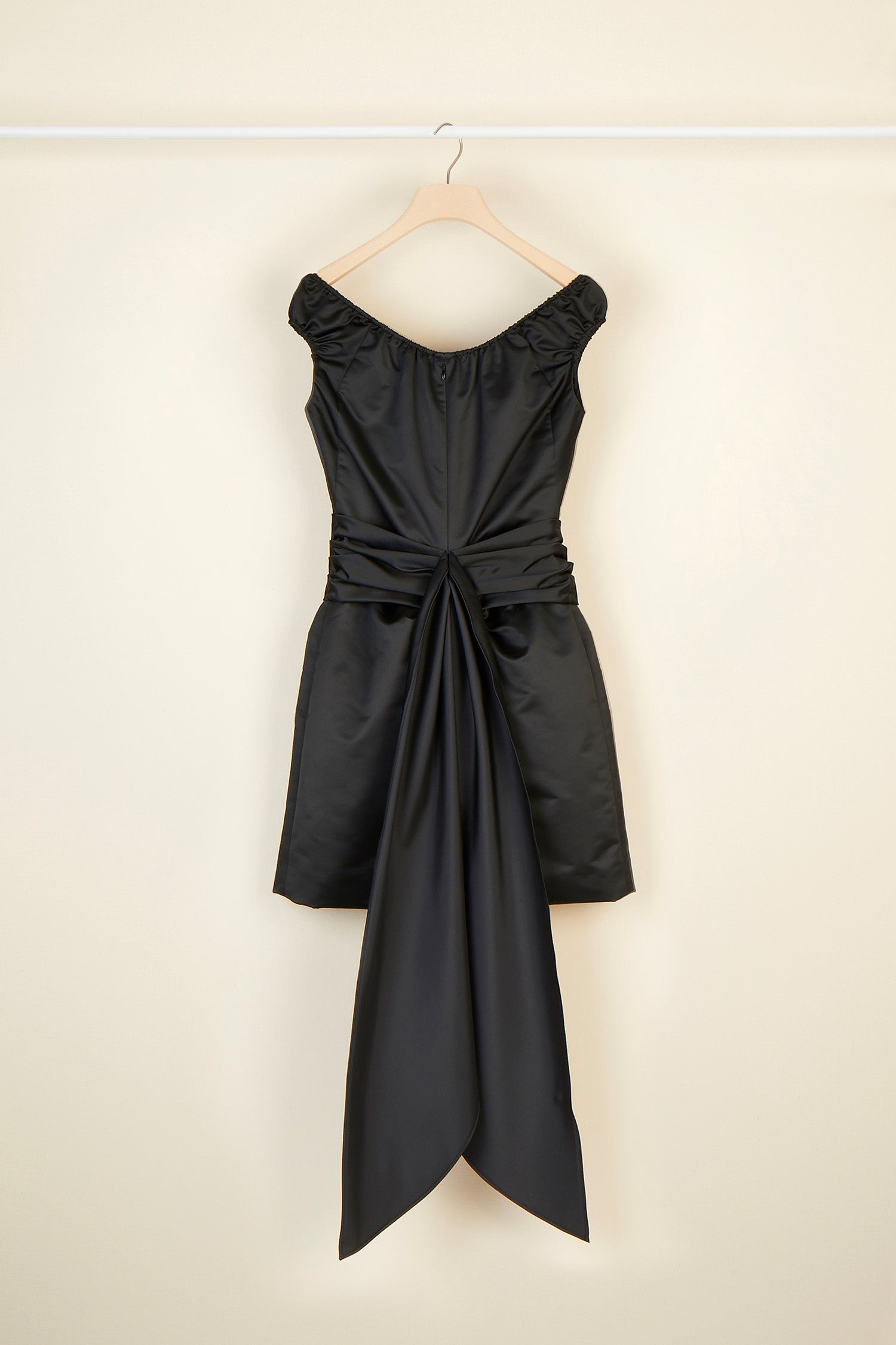Patou - Cold-shoulder dress with oversized draped panels - Black - The neckline emphasises the shoulders. Black duchesse satin dress. Elasticated neckline that can be worn off the shoulders. Draped panel around the waist that hangs long and loose at the back. Short skirt with shirred detailing. Zip fastening at the back. Fully lined.