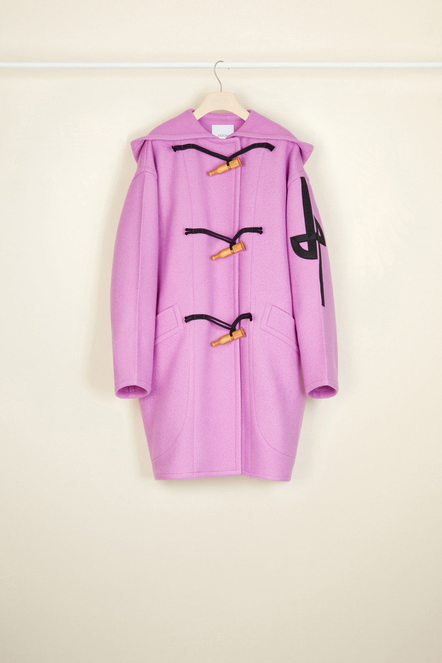 Patou - Cashmere and wool blend duffle coat - Raspberry - Wool and whistles.Raspberry pink cashmere and wool duffle coat. Crafted from recycled materials blended to achieve a softly worn look over time. Oversized silhouette. Hooded collar. Fastens via wooden buttons shaped like bird calls as well as concealed press buttons. Stylised JP logo embroidered in black on the left sleeve. Oversized patch pockets.