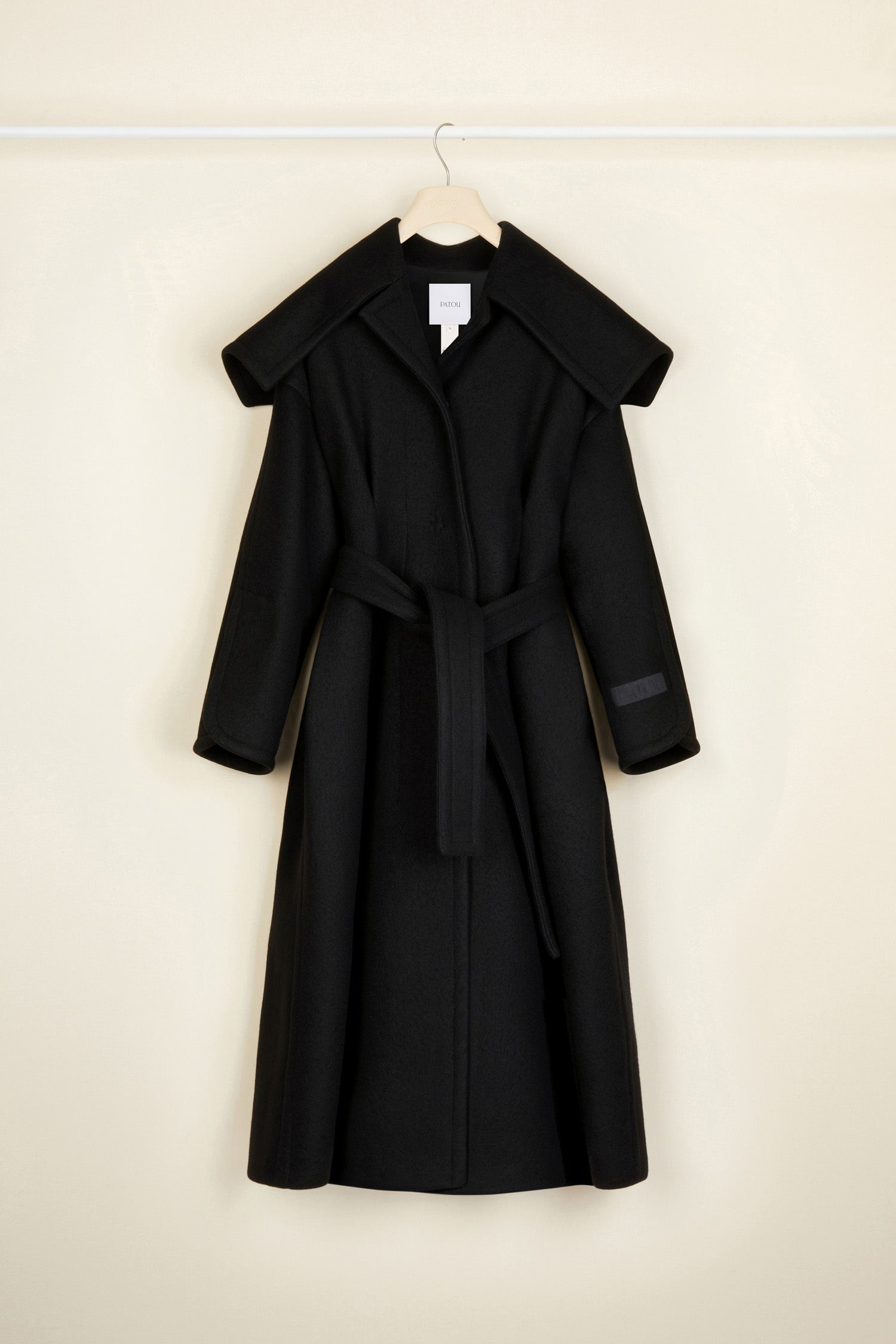 Patou - Belted cashmere and wool blend coat - Black - A sailor collar, et voilà, a classic overcoat with a Patou attitude!Black cashmere and wool coat. Crafted from recycled materials blended to achieve a softly worn look over time. Longline A-line silhouette with darts at the back to highlight the waist. Oversized sailor-style collar and cuffs. Can be worn cinched via a removable belt. Concealed press buttons down the front and at the cuffs. Patou label on the left sleeve.