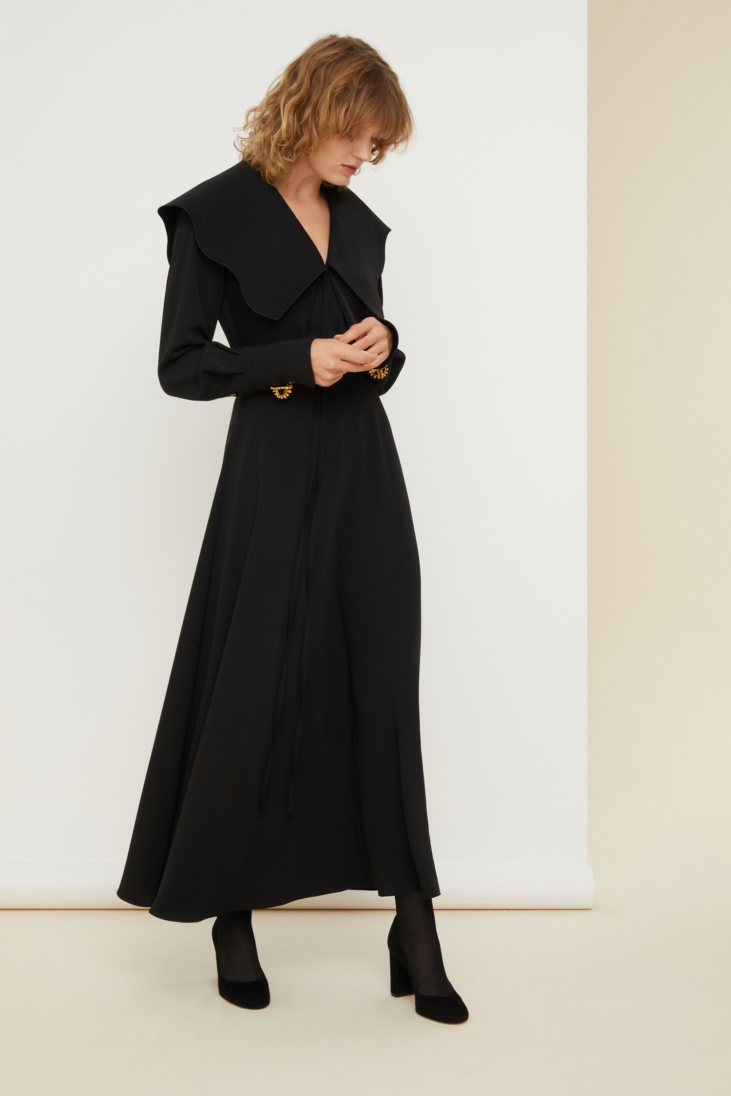 Patou - Oversized collar maxi dress - Black - The Patou touch? A spectacular collar. Black recycled cady maxi dress. Oversized collar featuring topstitching detailing all over with tie fastening at the front. Long sleeves with topstitched cuffs fastened via engraved gold-coloured buttons. Zip fastening at the side.Brooches sold separately