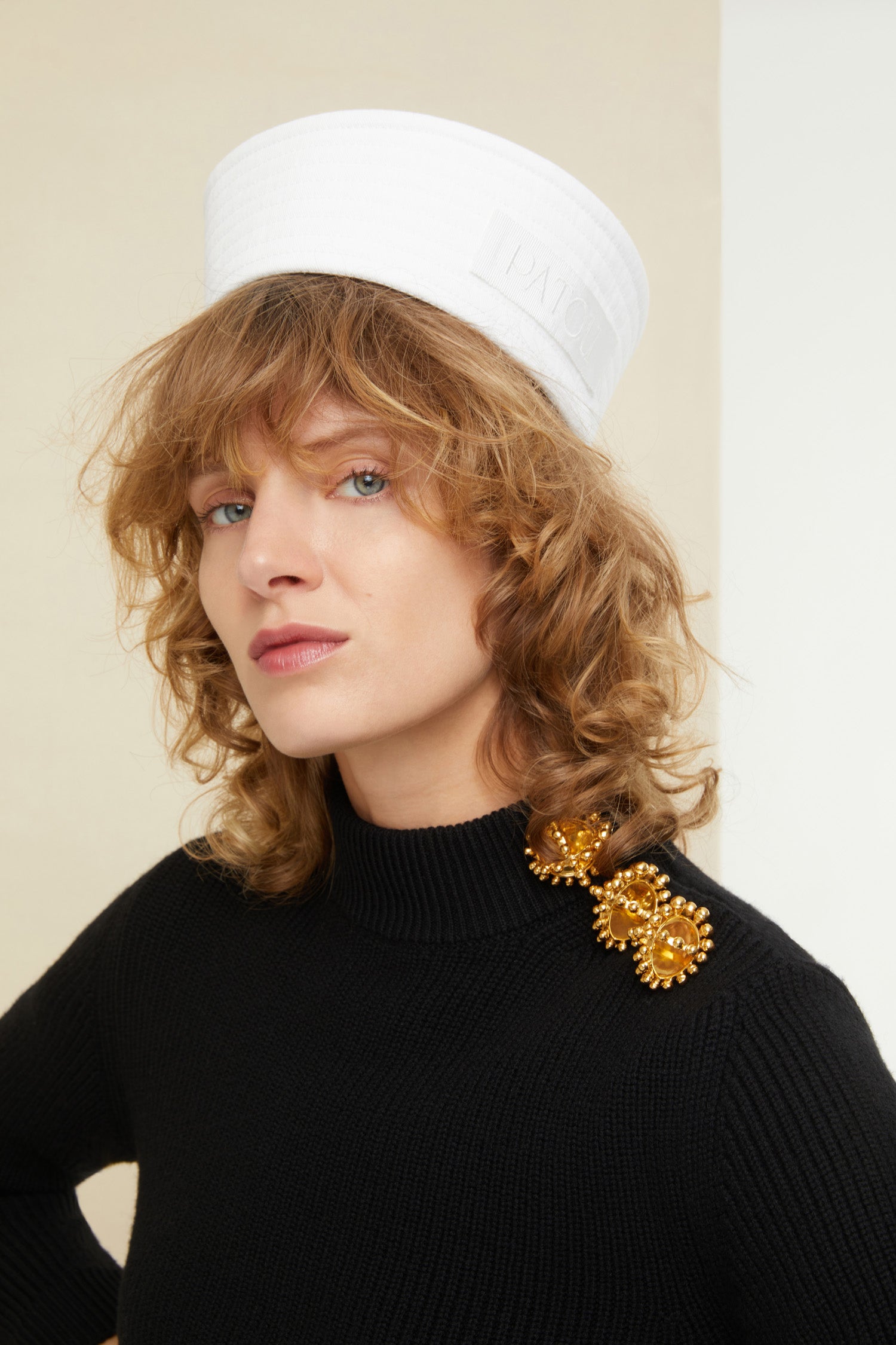 Patou - Brooch button Breton knit - Black - A button? No, make it a brooch! That’s so Patou. Black wool Breton jumper. Slightly cropped silhouette with three-quarter sleeves. Gold-coloured brooches and concealed press buttons on the left shoulder.
