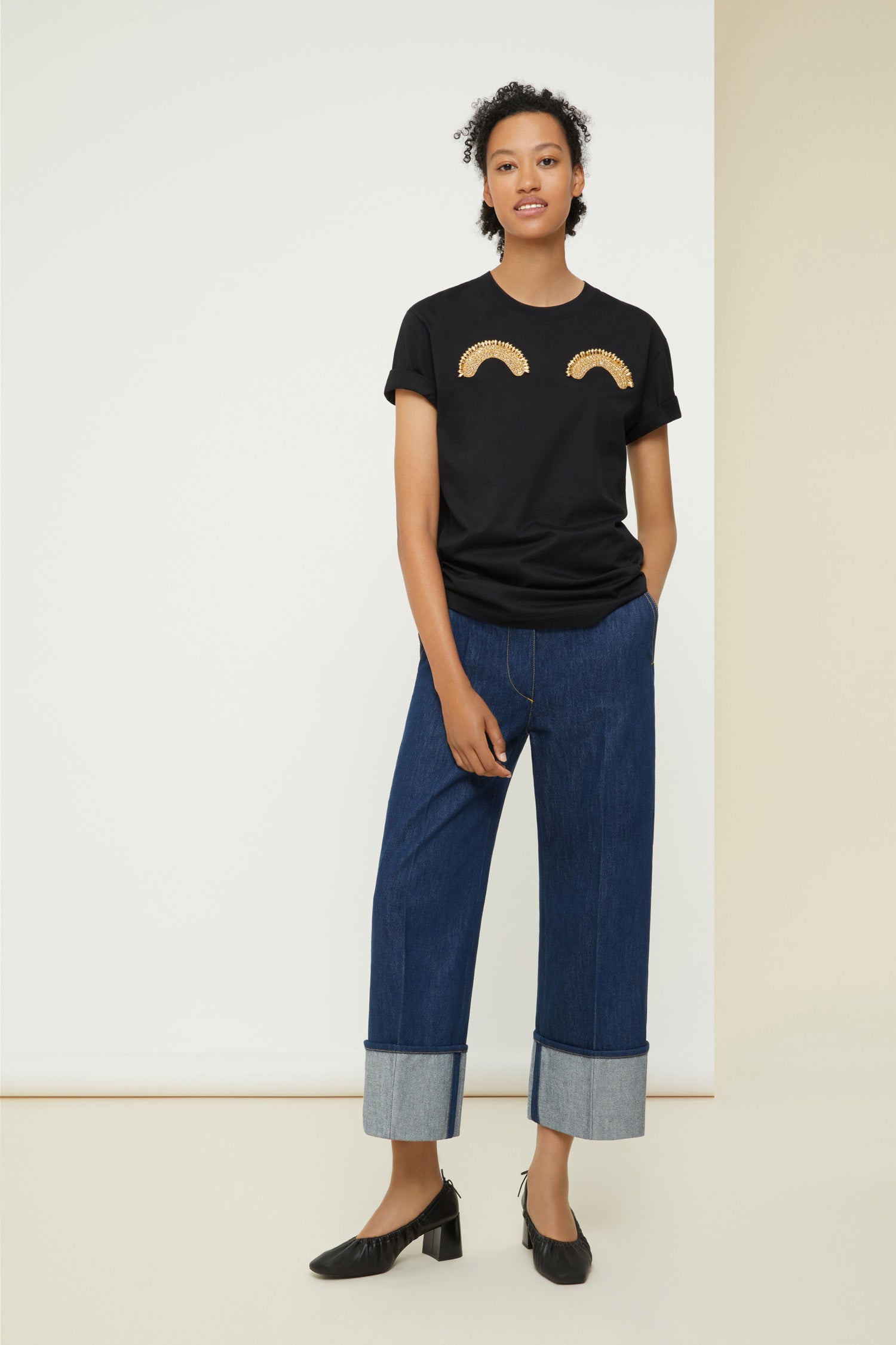 Patou - Embellished logo T-shirt in organic cotton - Black - A sense of humour and a hint of couture, a true Patou signature.Black organic cotton t-shirt. Crewneck style. Regular fit. Gold-coloured beading at the front. Black Patou logo at the back.