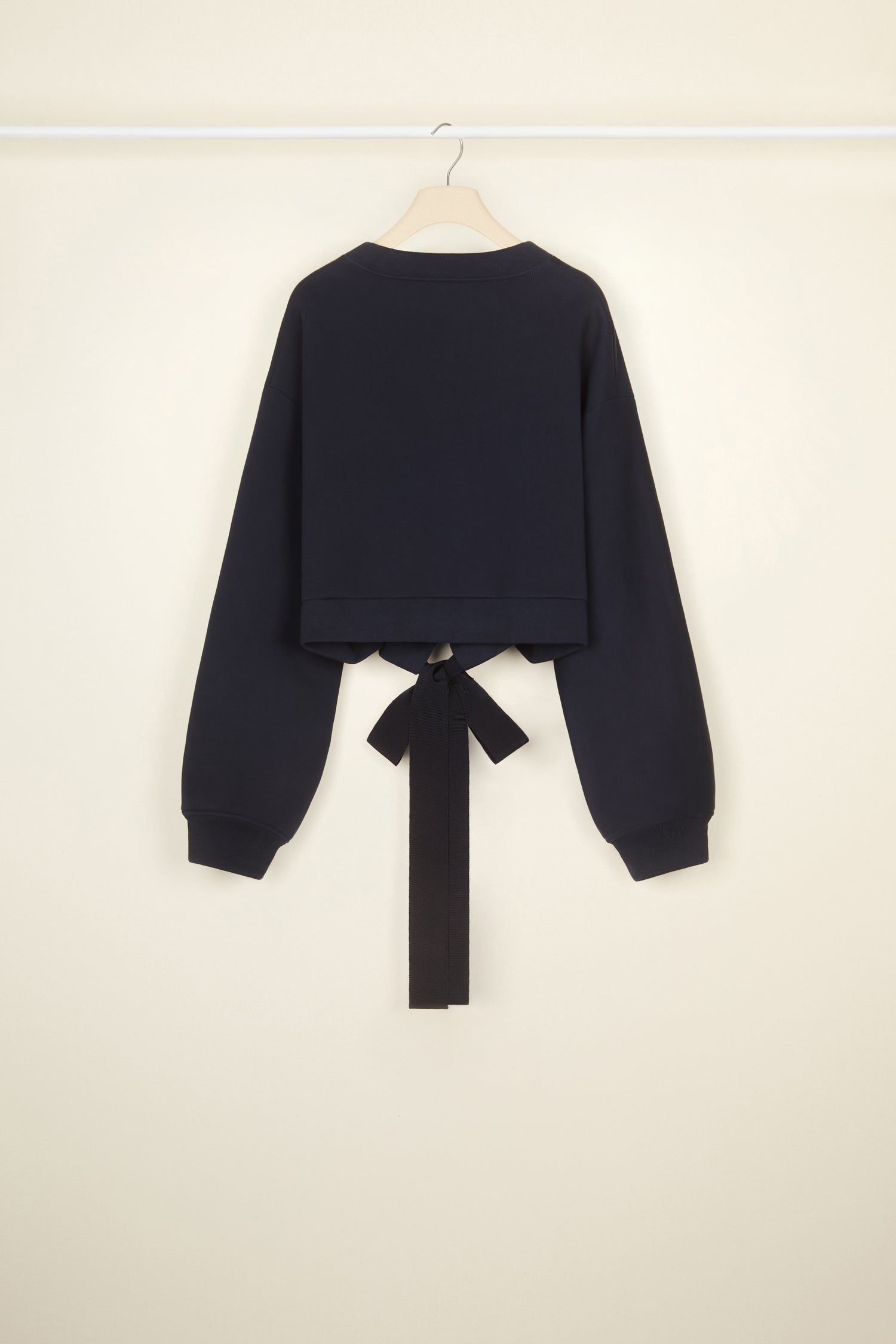 Patou - Cropped grosgrain sweatshirt in organic cotton - Navy Black - Comfort with a side of couture: the sweatshirt by Patou.Navy Black organic cotton sweatshirt. Loose cropped silhouette. Crewneck. Rib knit collar and cuffs. Oversized Patou lettering logo in white across the front. Drawstring waistband with long grosgrain ties.