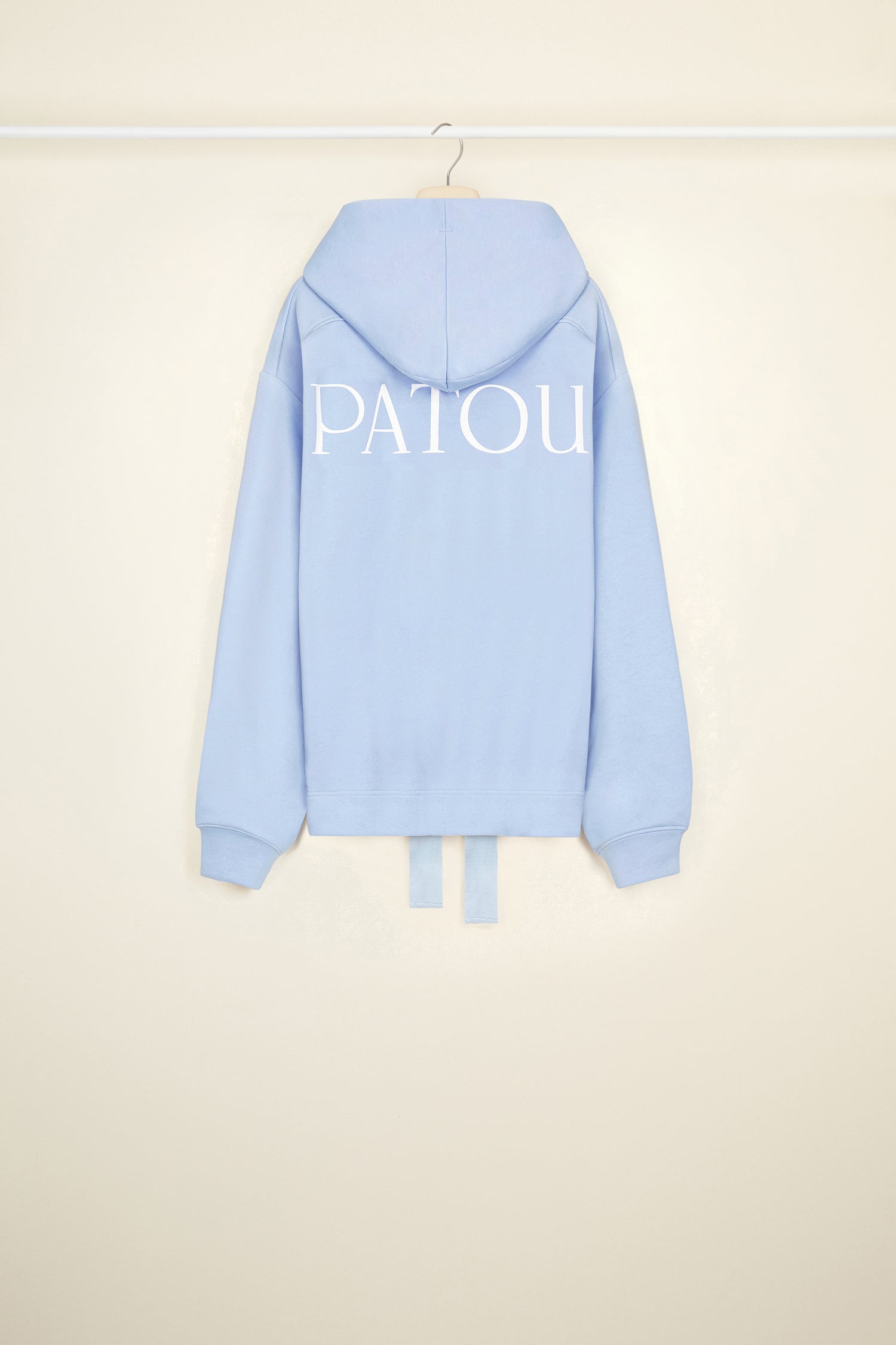 Patou - Patou grosgrain hoodie in organic cotton - Aurora - An everyday uniform for the whole Patou crew. Aurora light blue organic cotton hoodie. Unisex style. Hooded collar with grosgrain drawstring. Dropped embossed shoulders. Patou lettering logo embroidered at the front. Patou lettering logo printed in white across the back. Ribbed cuffs.Loose fit (select one size down for a fitted look).
