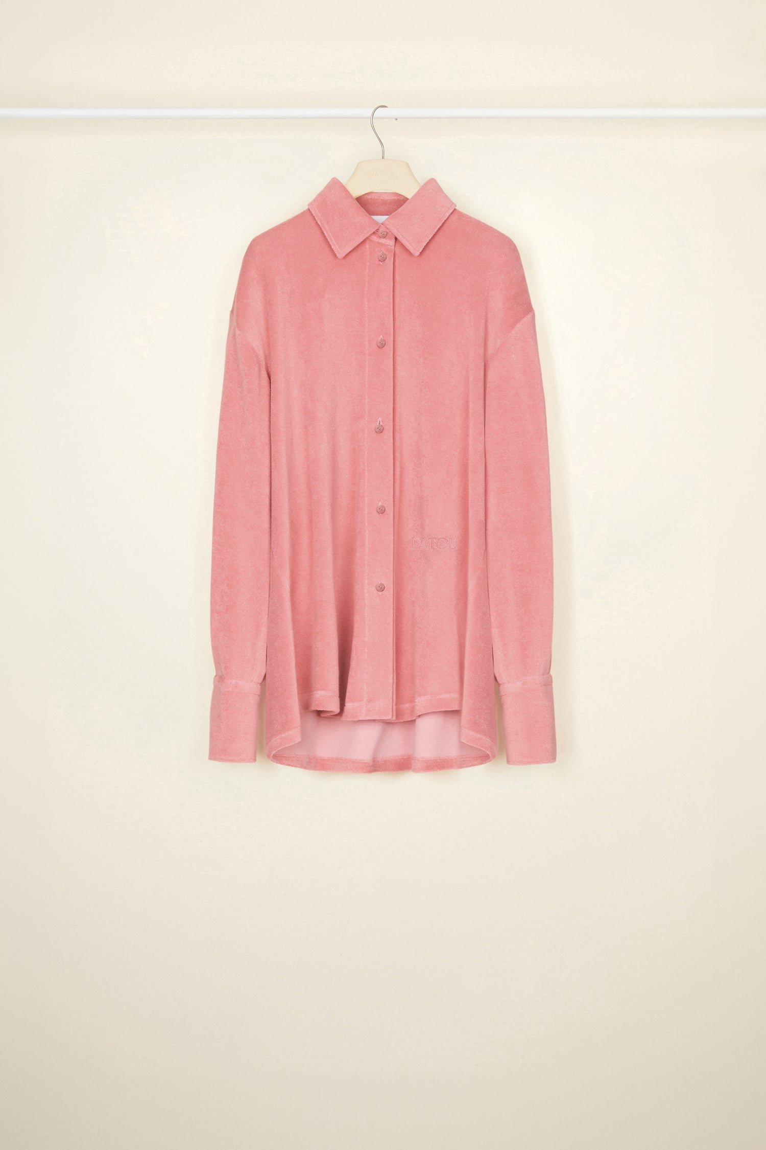 Patou - Oversized terry shirt in organic cotton blend - Antique Pink - Smile harder, dress softer.Antique Pink terry shirt in organic cotton blend. Loose longline silhouette. Shirt collar. Button fastening with JP engraved buttons at the front. Signature curved seam and knife pleats at the back. Long sleeves with volume at the cuffs.