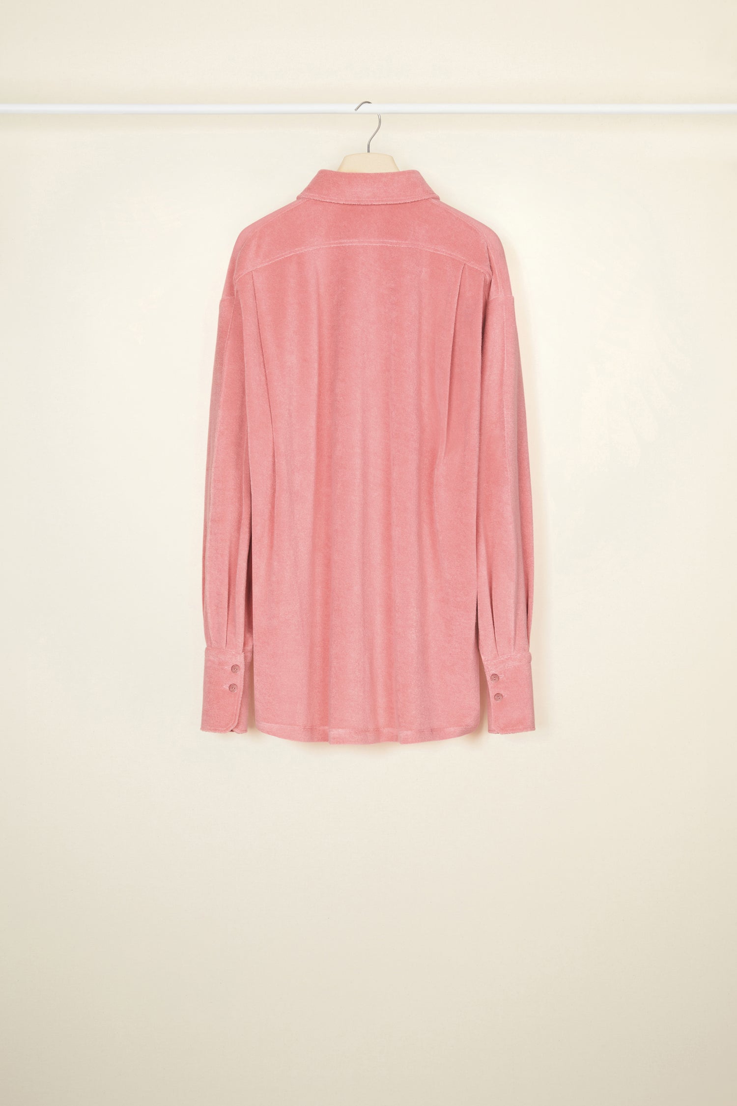 Patou - Oversized terry shirt in organic cotton blend - Antique Pink - Smile harder, dress softer.Antique Pink terry shirt in organic cotton blend. Loose longline silhouette. Shirt collar. Button fastening with JP engraved buttons at the front. Signature curved seam and knife pleats at the back. Long sleeves with volume at the cuffs.
