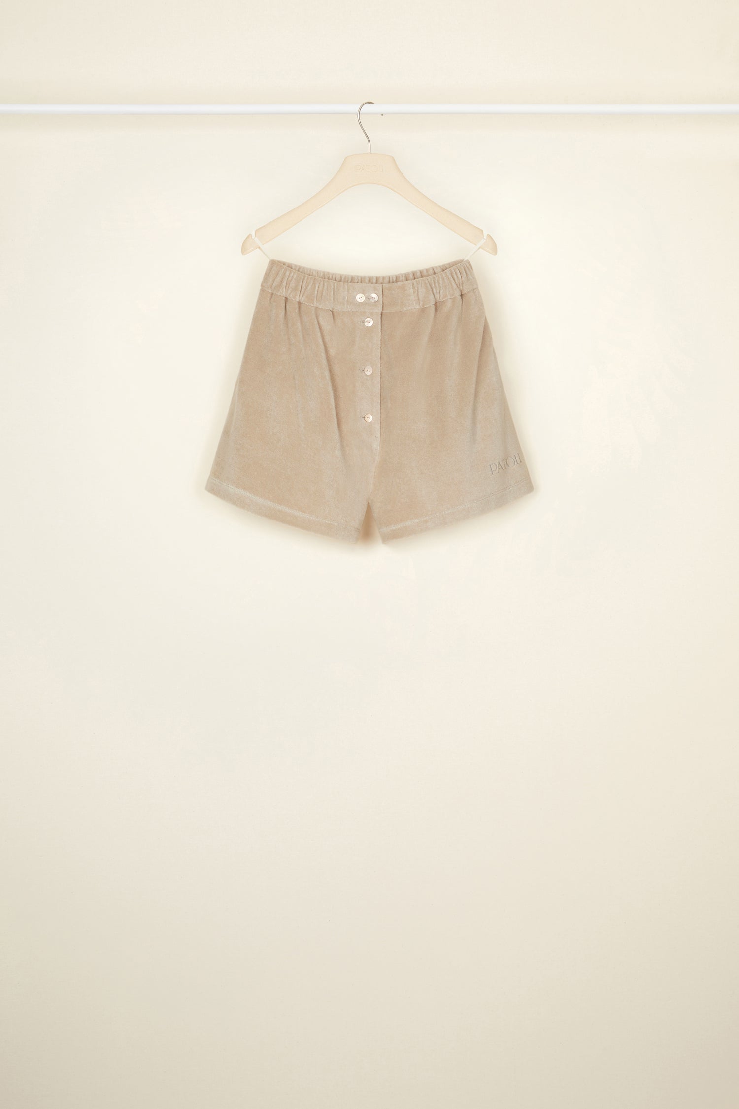 Patou - Terry boxer shorts in organic cotton blend - Parchment - Smile harder, dress softer.Parchment beige terry shorts in organic cotton blend. Elasticated waist. Button fastening at the front with JP engraved buttons. Seam pockets at the sides. Patou lettering logo embroidered at the front.