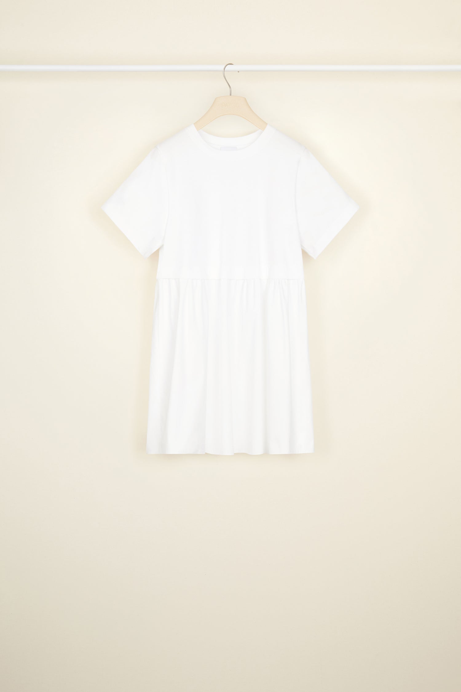 Patou - Mixed media mini dress in organic cotton - White - No mistaking this classic Patou trompe-l'oei!White organic cotton dress. Short length. Mixed media style. Top half: cropped jersey tee with round neckline, short sleeves, Patou lettering logo and JP monogram in black at the back. Bottom half: poplin skirt.