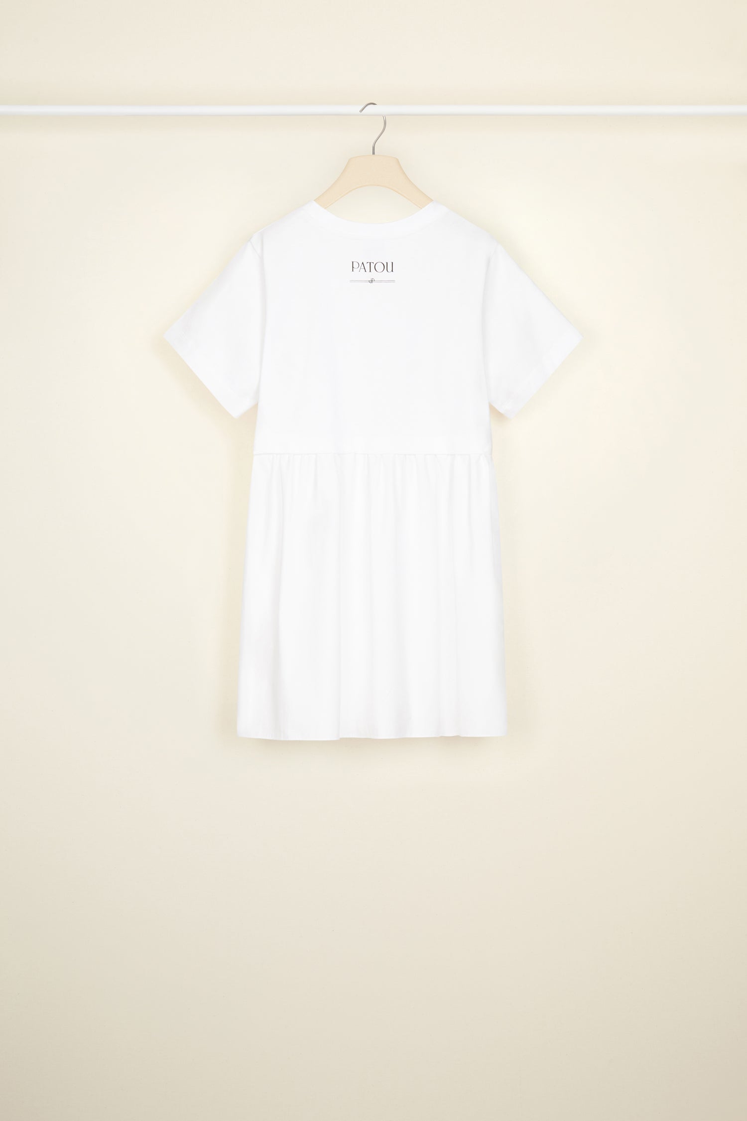 Patou - Mixed media mini dress in organic cotton - White - No mistaking this classic Patou trompe-l'oei!White organic cotton dress. Short length. Mixed media style. Top half: cropped jersey tee with round neckline, short sleeves, Patou lettering logo and JP monogram in black at the back. Bottom half: poplin skirt.
