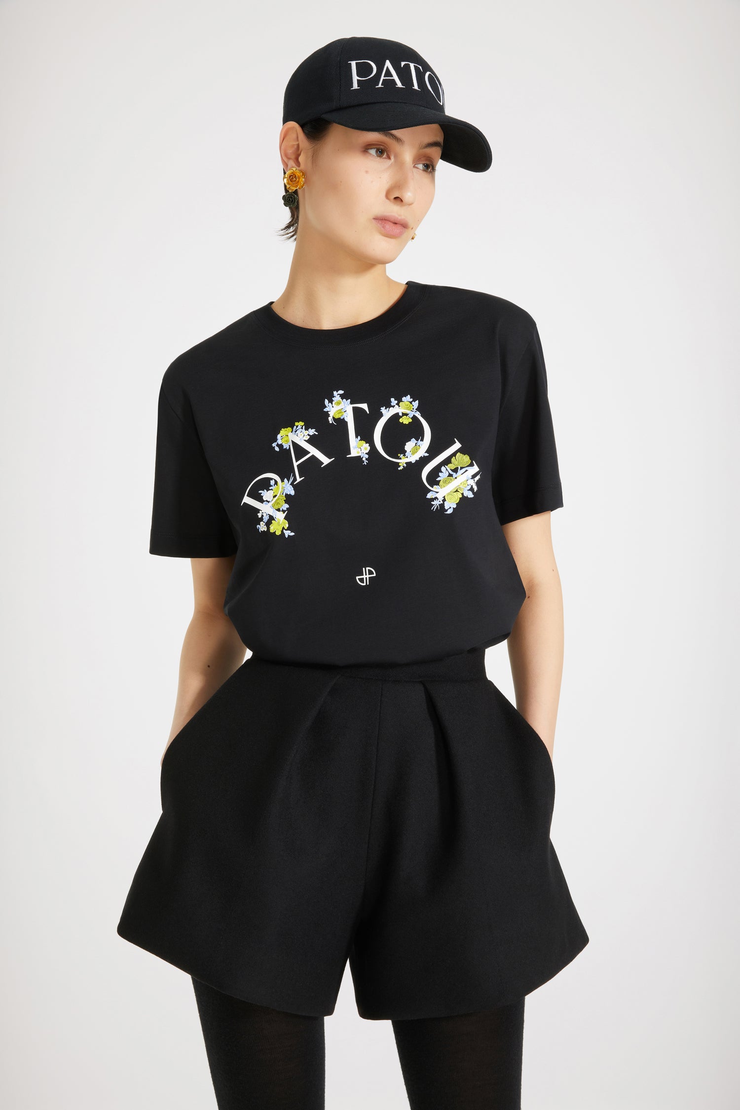 Patou - Floral Patou t-shirt in organic cotton - Black - Spell it with flowers: PATOU! Black organic cotton t-shirt. Crewneck. White Patou logo and monogram at the front.