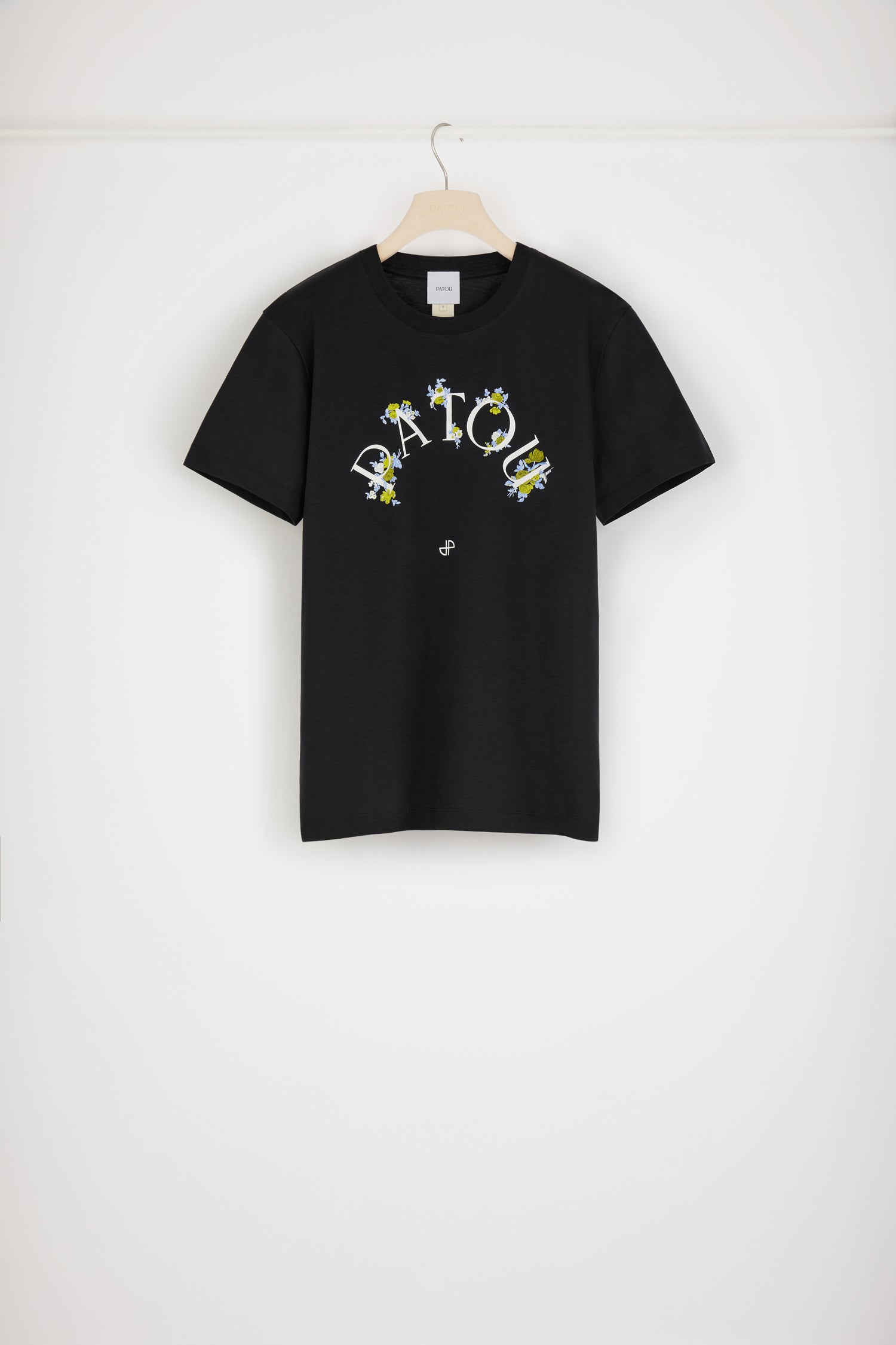 Patou - Floral Patou t-shirt in organic cotton - Black - Spell it with flowers: PATOU! Black organic cotton t-shirt. Crewneck. White Patou logo and monogram at the front.