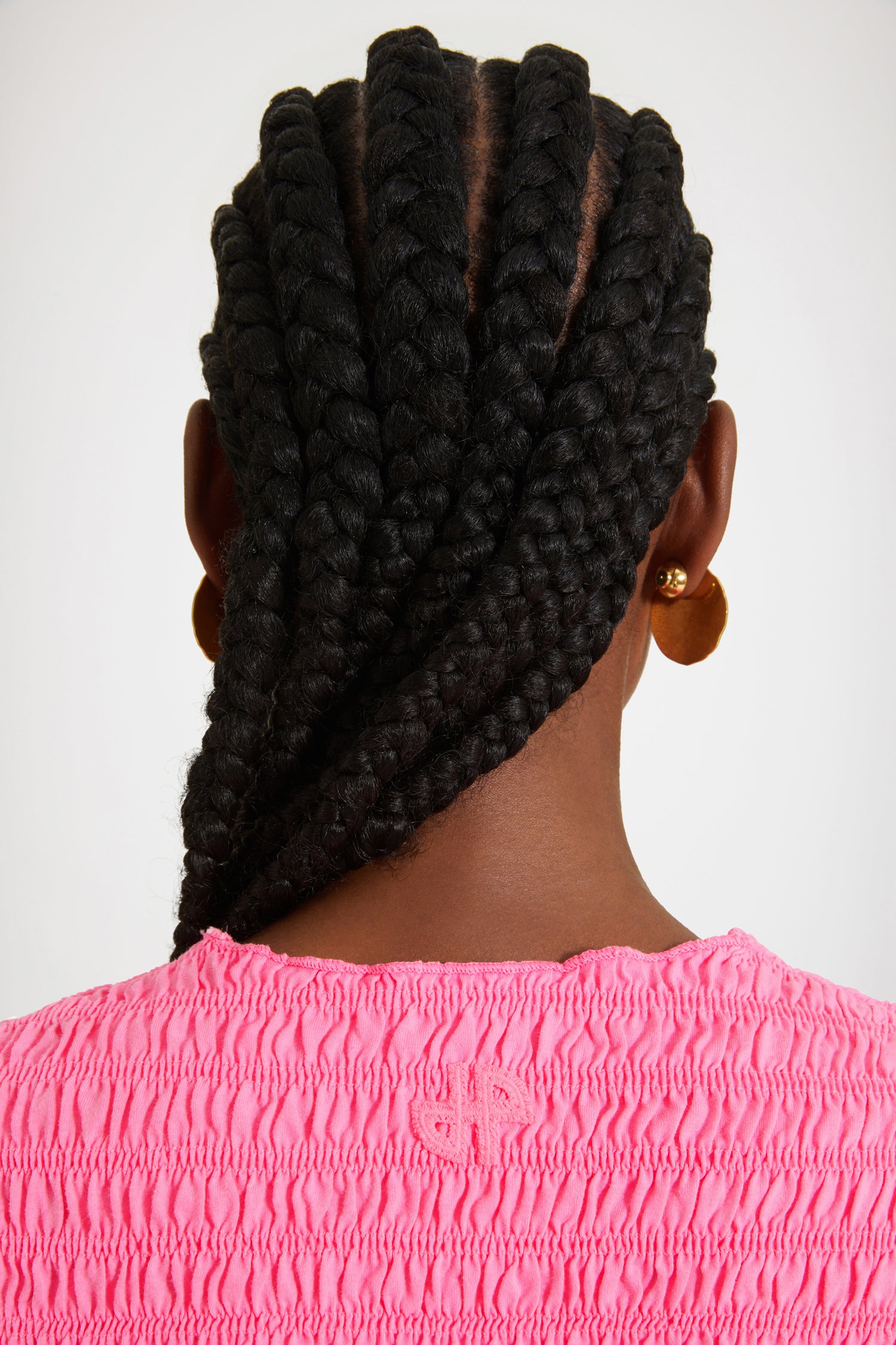 Patou - Smock top in organic cotton - Begonia Pink - Looking smockin', feeling gorgeous.Begonia pink organic cotton top. Fitted style. Smocked detailing all over. Round neckline. Mid-length sleeves. Tonal JP monogram appliqué at the back.This top is very skin-tight and fitted.