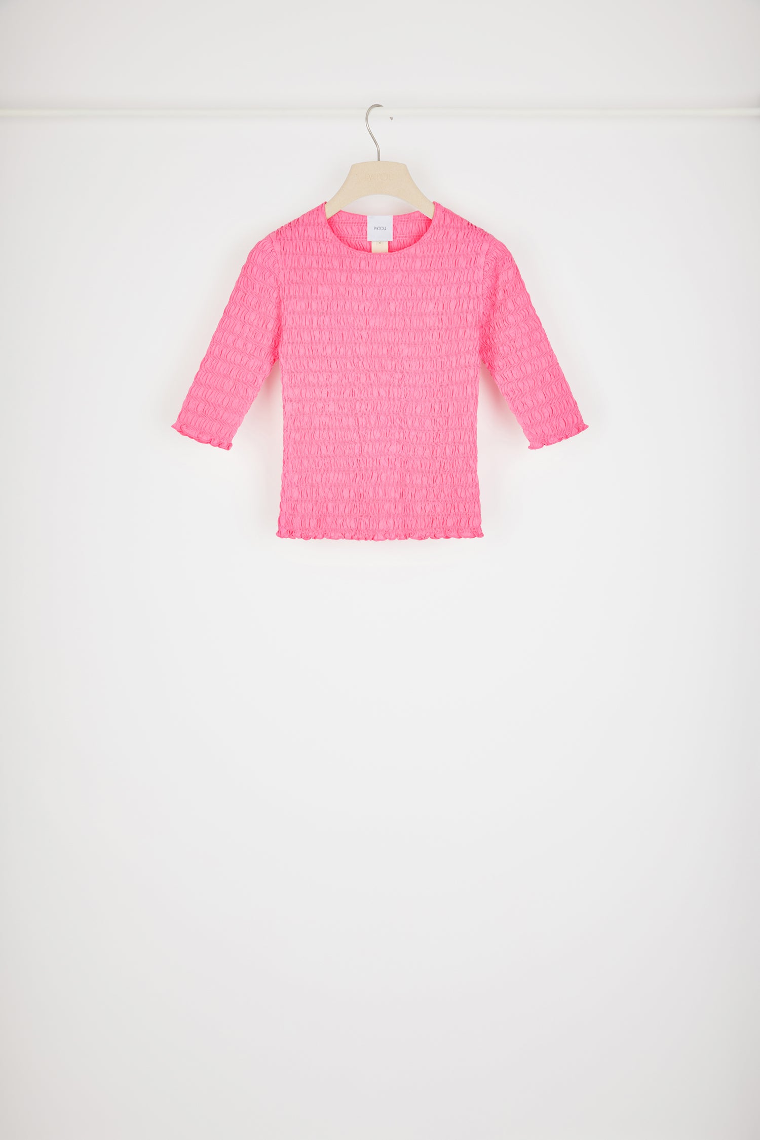 Patou - Smock top in organic cotton - Begonia Pink - Looking smockin', feeling gorgeous.Begonia pink organic cotton top. Fitted style. Smocked detailing all over. Round neckline. Mid-length sleeves. Tonal JP monogram appliqué at the back.This top is very skin-tight and fitted.