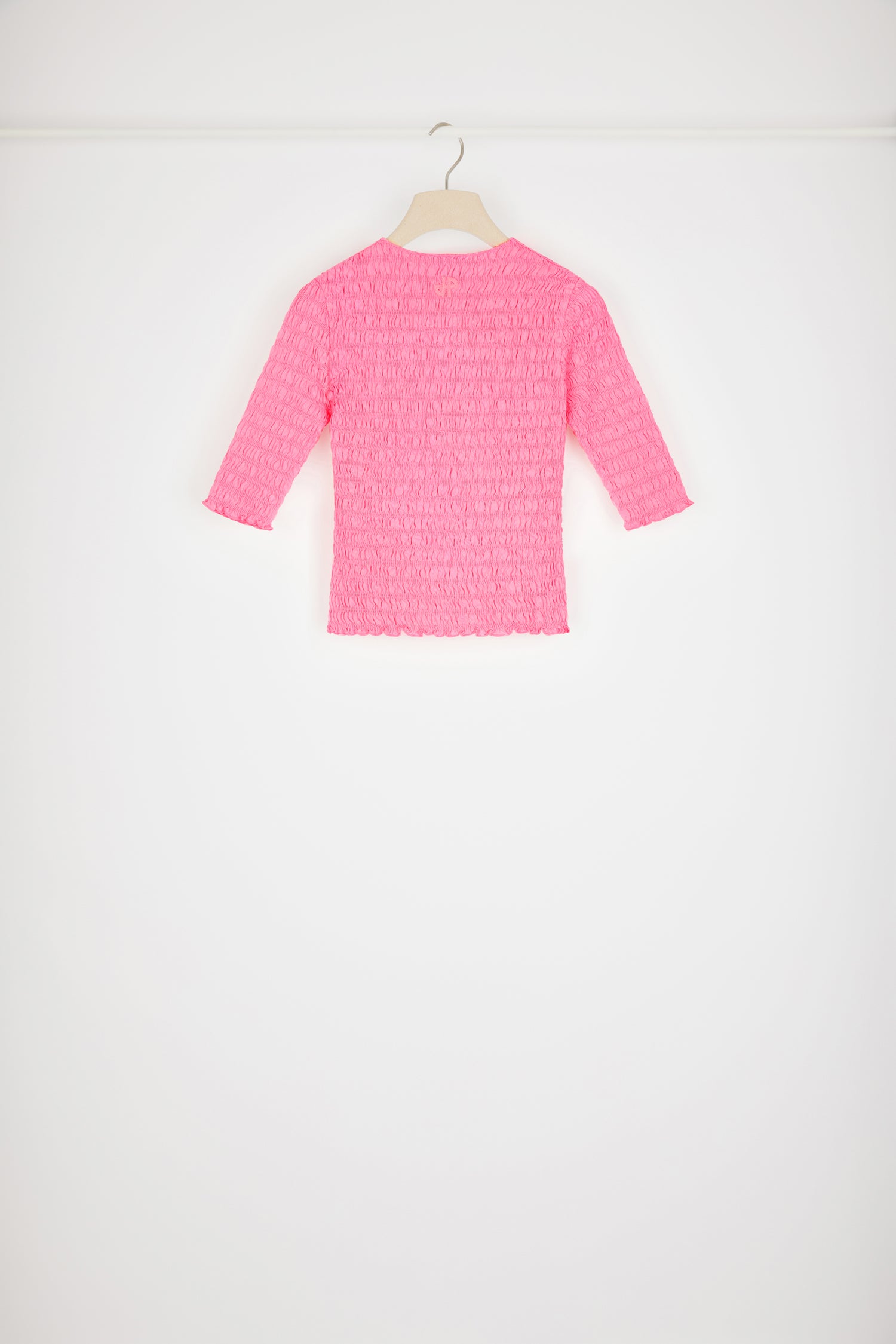 Patou - Smock top in organic cotton - Begonia Pink - Looking smockin', feeling gorgeous.Begonia pink organic cotton top. Fitted style. Smocked detailing all over. Round neckline. Mid-length sleeves. Tonal JP monogram appliqué at the back.This top is very skin-tight and fitted.