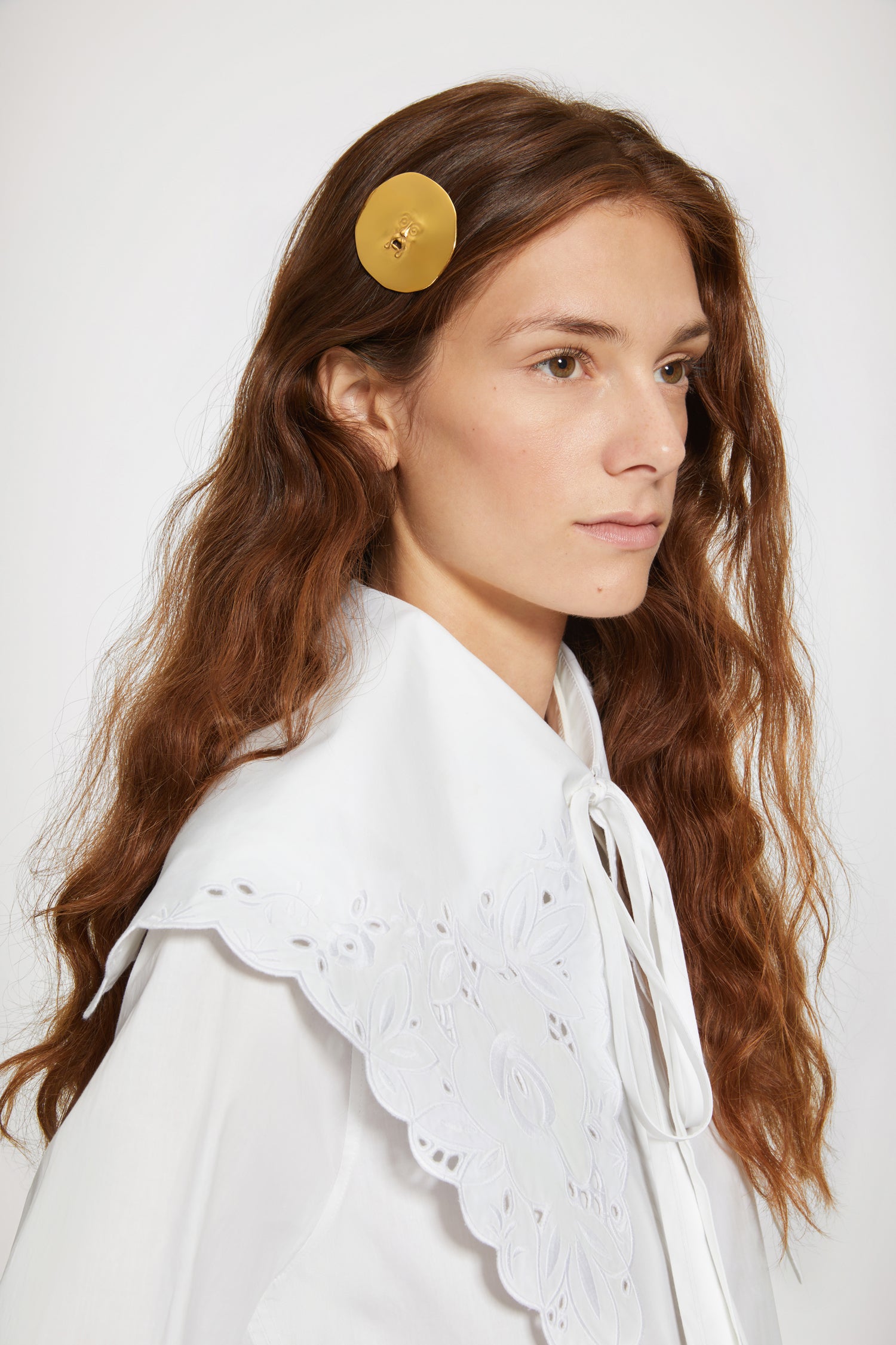 Patou - Large face brass hairclip - Gold - A legendary face, a fetching accessory.Large brass hairclip with a “Bocca della Verità”-inspired design.