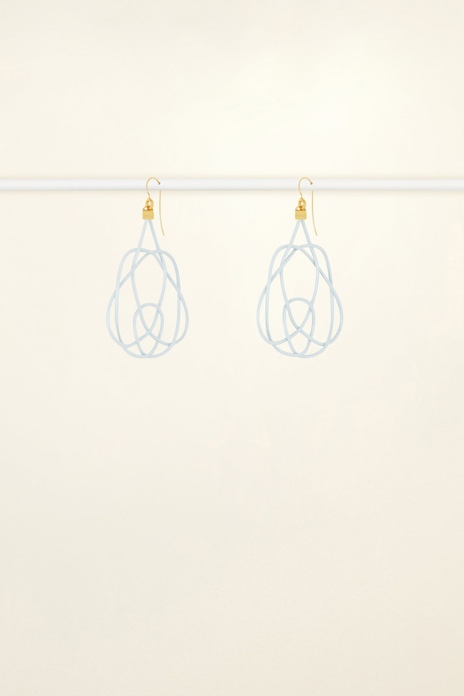 Patou - Wicker earrings - Sky Blue - Lighter, brighter, our favourite earrings are made of wicker.Sky Blue painted wicker earrings. Symmetric curved shape. Hook fastening suitable for pierced ears.