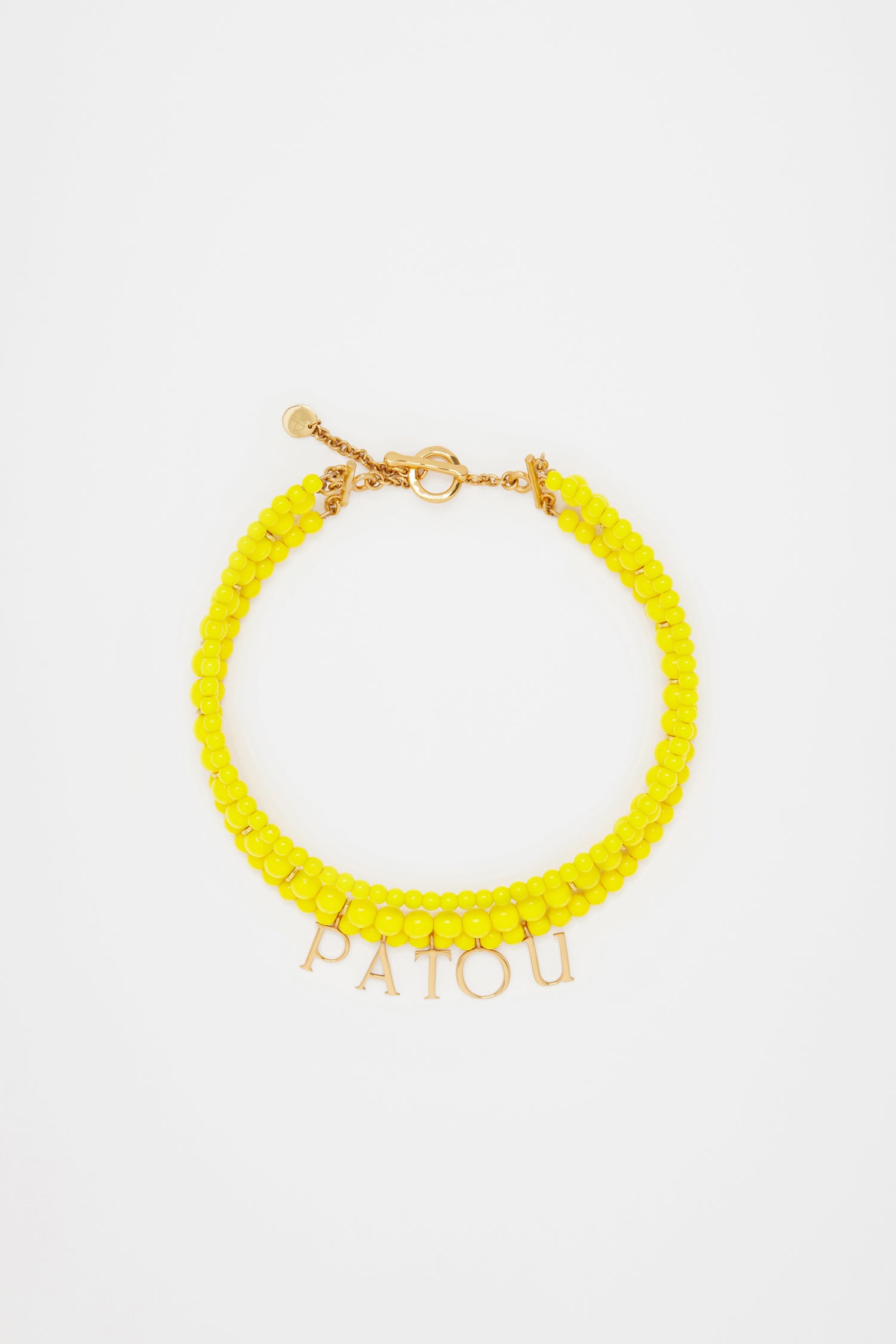 Patou - Patou coloured glass-bead necklace - Mimosa - Pearls that pop, by Patou.Mimosa yellow glass bead necklace. Multiple strands with assorted size pearl-style beads and gold-tone details. Gold-plated Patou letters. Gold-tone clasp fastening with JP-engraved medallion.