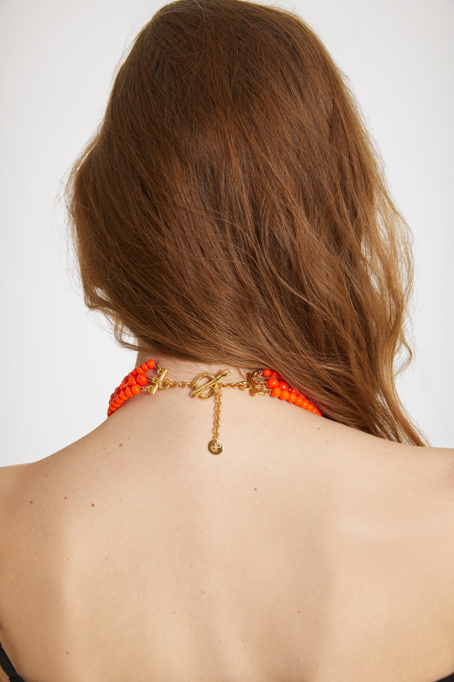 Patou - Patou coloured glass-bead necklace - Marigold - Pearls that pop, by Patou.Marigold orange glass bead necklace. Multiple strands with assorted size pearl-style beads and gold-tone details. Gold-plated Patou letters. Gold-tone clasp fastening with JP-engraved medallion.
