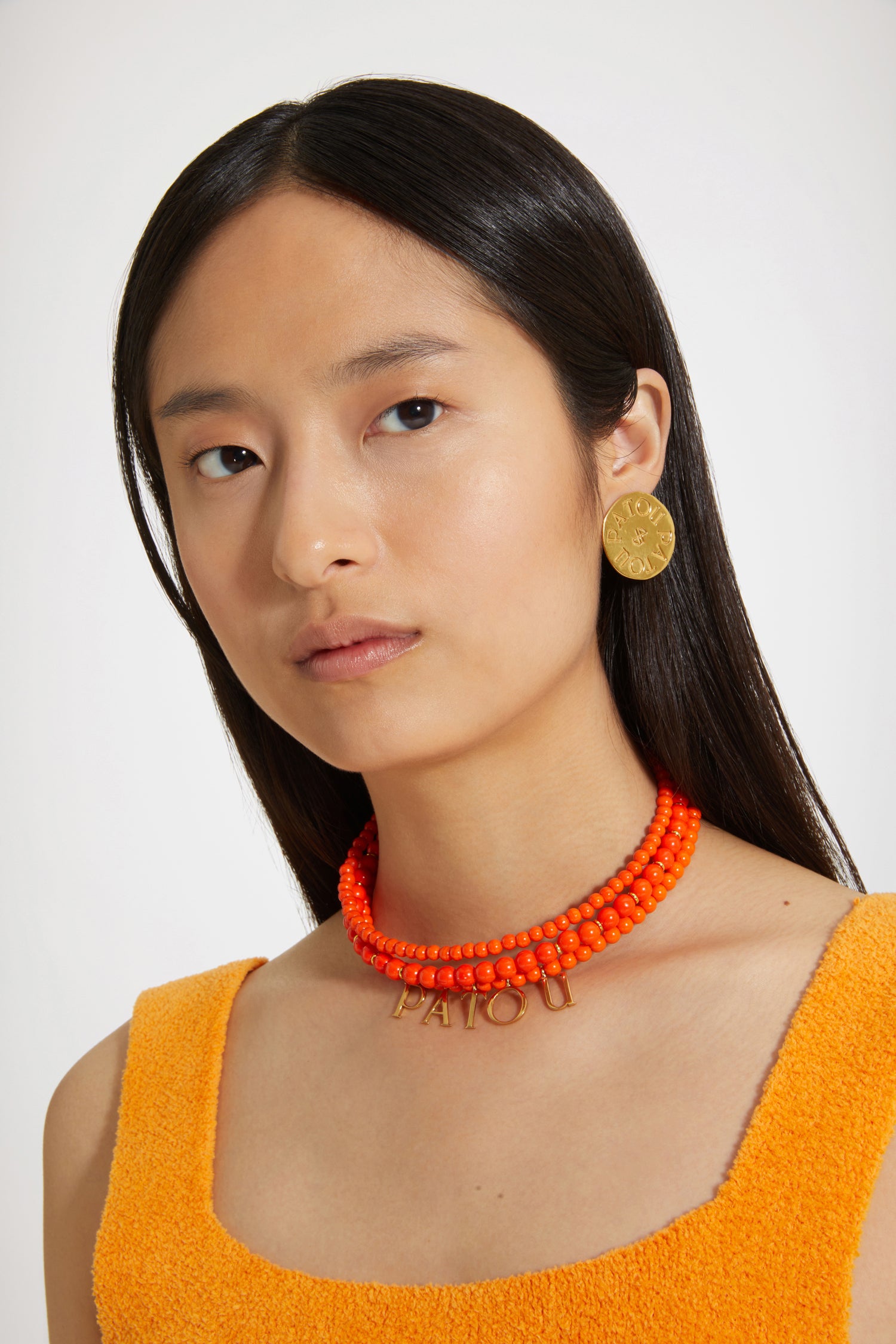 Patou - Patou coloured glass-bead necklace - Marigold - Pearls that pop, by Patou.Marigold orange glass bead necklace. Multiple strands with assorted size pearl-style beads and gold-tone details. Gold-plated Patou letters. Gold-tone clasp fastening with JP-engraved medallion.