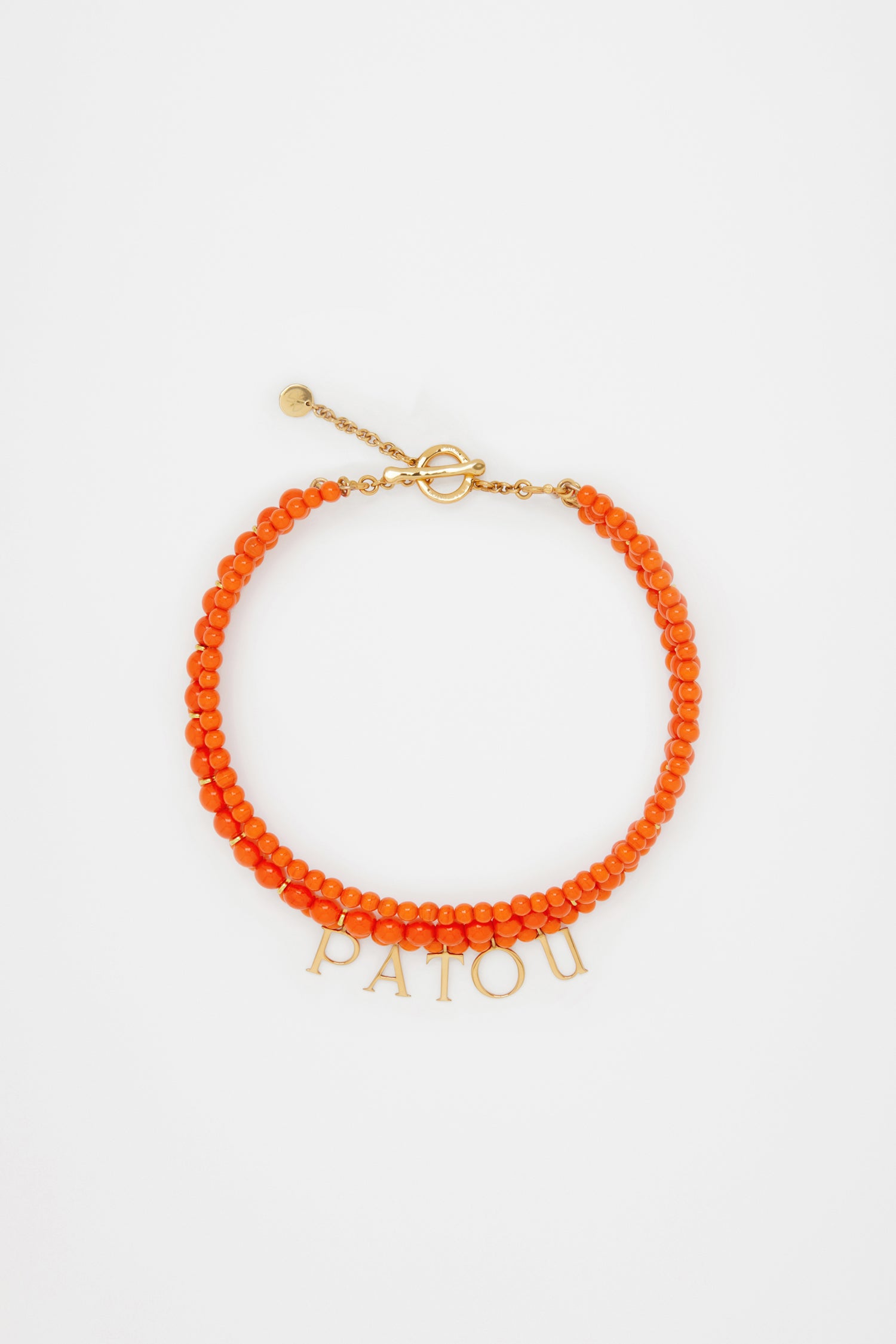 Patou - Patou coloured glass-bead necklace - Marigold - Pearls that pop, by Patou.Marigold orange glass bead necklace. Multiple strands with assorted size pearl-style beads and gold-tone details. Gold-plated Patou letters. Gold-tone clasp fastening with JP-engraved medallion.