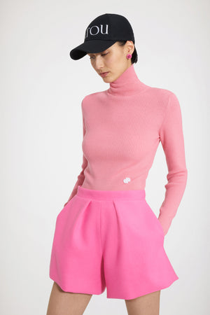 Maglione a collo alto in lana a costine