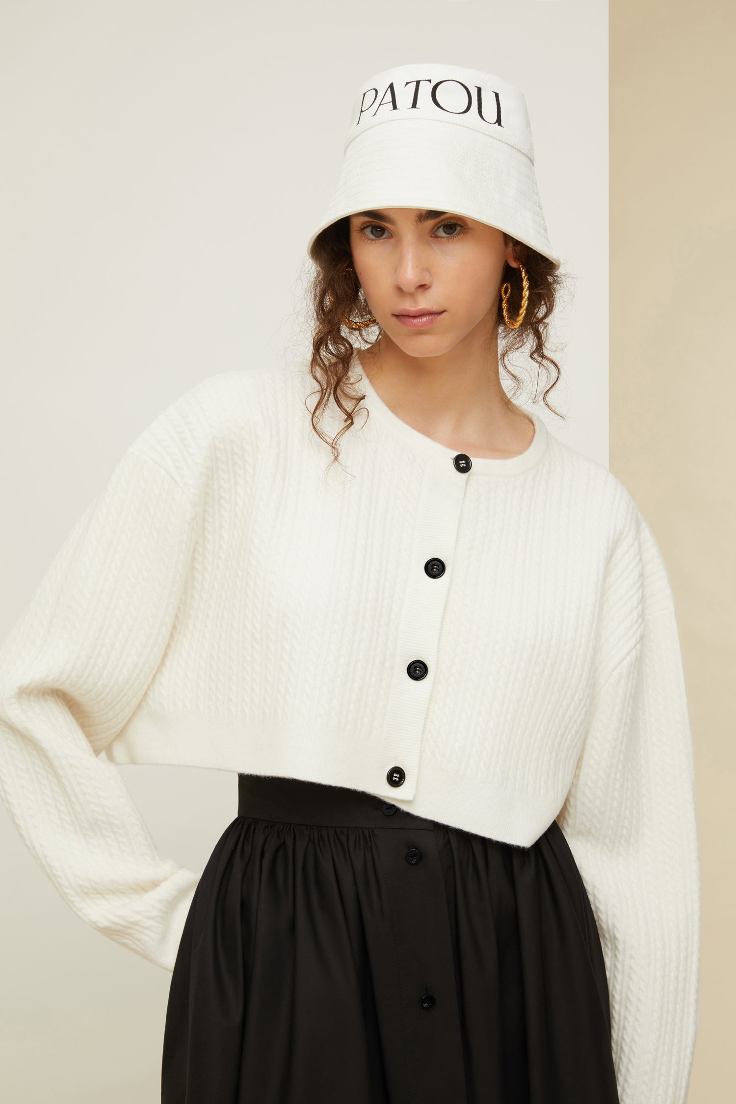 Patou - Cropped cable knit cardigan in recycled wool blend - White - Cable + cropped: the new knitwear equation.White recycled wool blend cardigan. Cropped silhouette. 3D cable knit detailing. Round neckline. Button fastening at the front with JP engraved buttons.