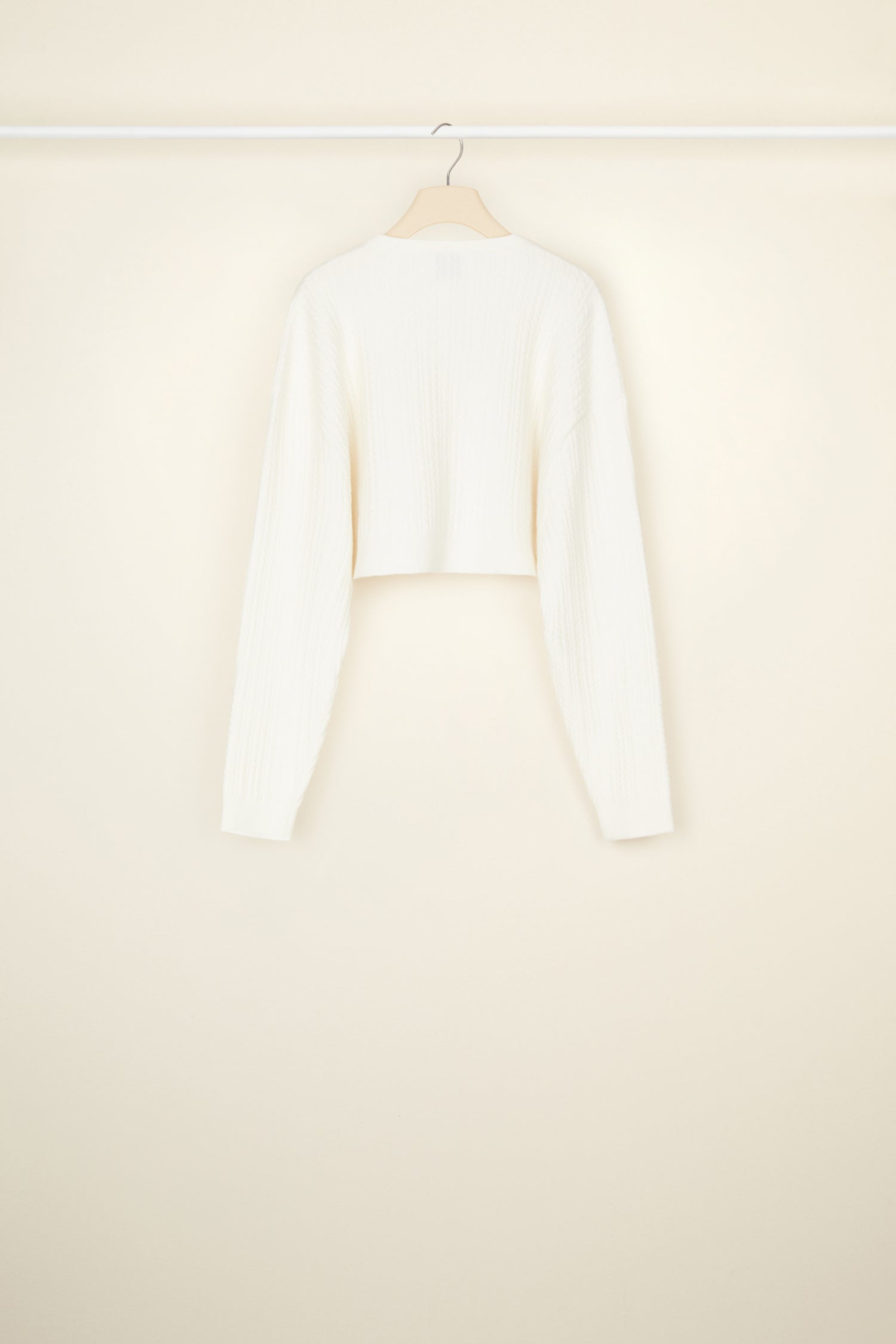 Patou - Cropped cable knit cardigan in recycled wool blend - White - Cable + cropped: the new knitwear equation.White recycled wool blend cardigan. Cropped silhouette. 3D cable knit detailing. Round neckline. Button fastening at the front with JP engraved buttons.