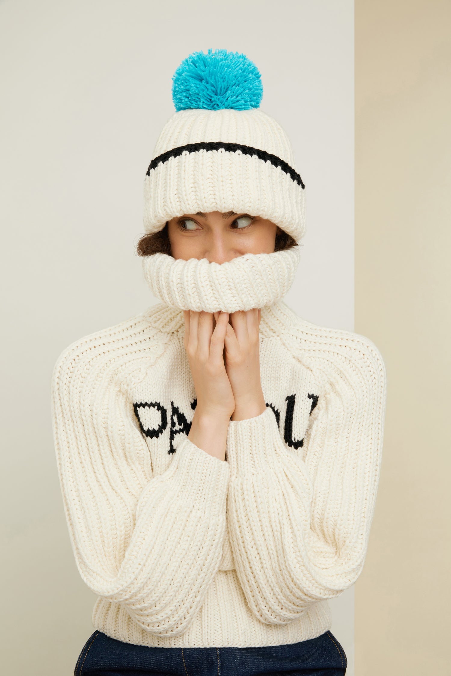 Patou - Patou Neige wool jumper - Ivory - Smile for the winter in the cosiest Patou jumper. Ivory Merino wool jumper. Part of the Patou Neige collection. Hand knitted garment featuring multiple stitch styles. Cropped, fitted silhouette. Turtleneck collar. High volume sleeves. Black Patou Neige signature and handwriting logo.