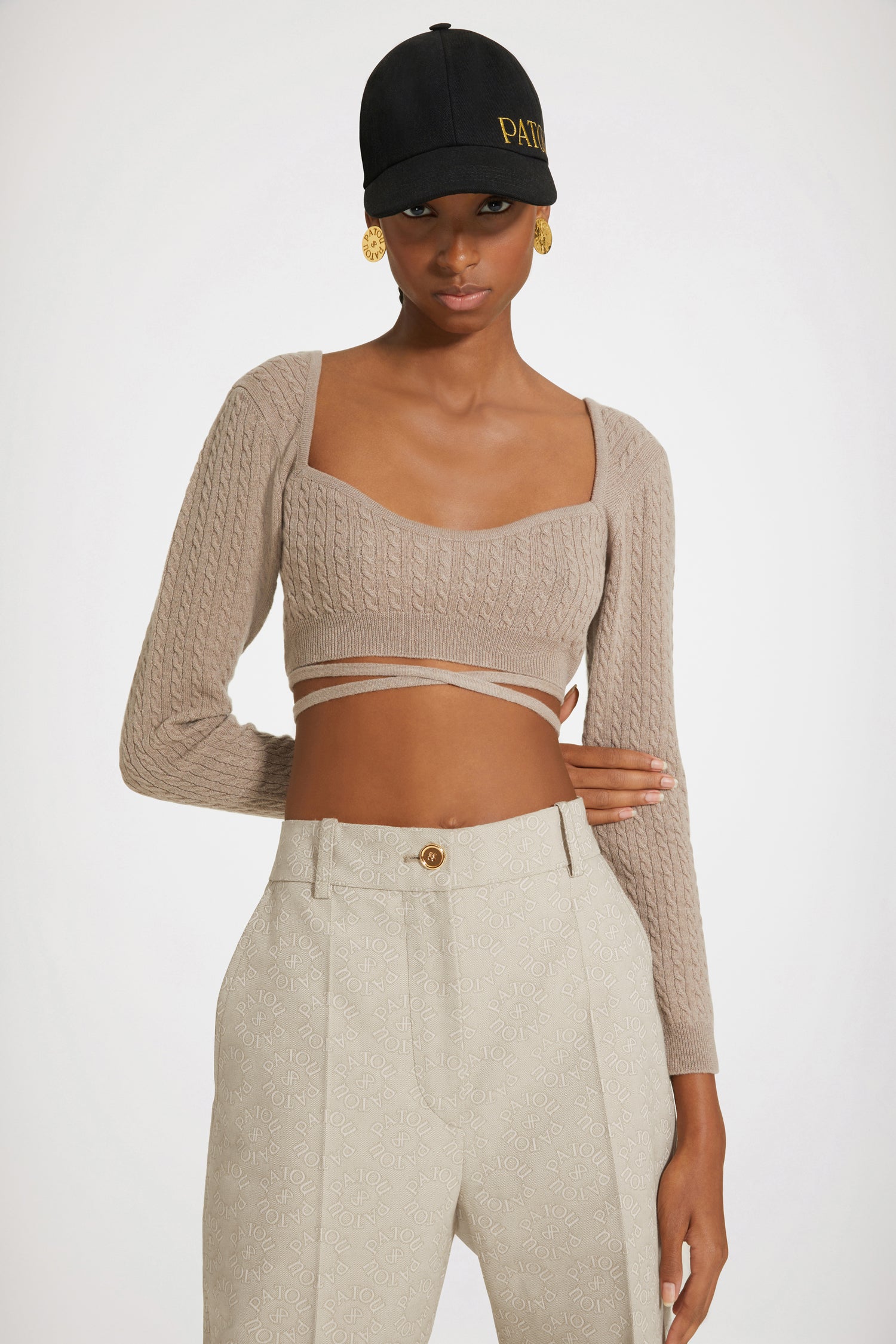 Patou - Wrap-back cable knit top in wool and cashmere - Parchment - A cable knit top wraps the body in alluring architectures.Parchment beige wool and cashmere top. Cable knit. Cropped silhouette. Sweetheart neckline. Trompe-l'oeil wrap back. Ties that wrap around the waist.