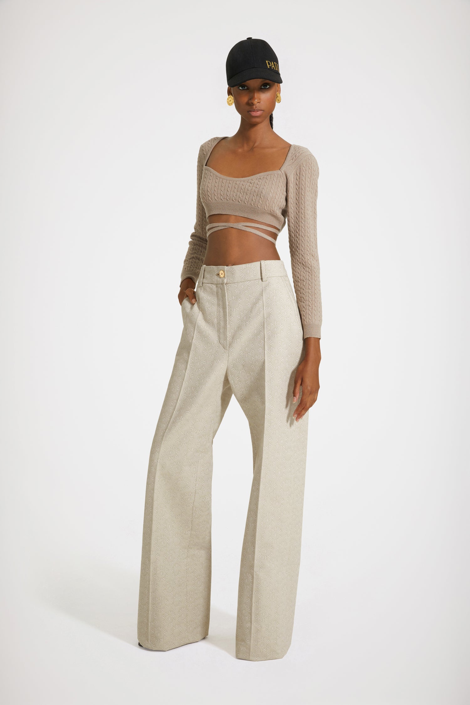 Patou - Wrap-back cable knit top in wool and cashmere - Parchment - A cable knit top wraps the body in alluring architectures.Parchment beige wool and cashmere top. Cable knit. Cropped silhouette. Sweetheart neckline. Trompe-l'oeil wrap back. Ties that wrap around the waist.