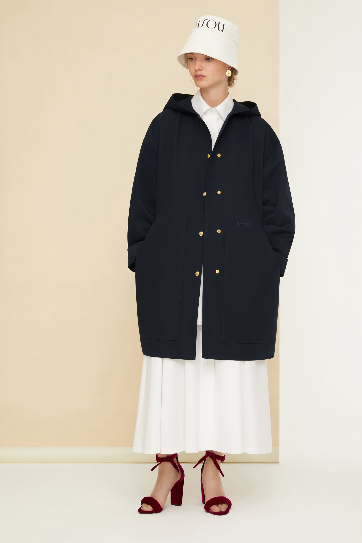 Patou - Patou oversized parka in organic cotton - Night Blue - Ready to brave the elements with a smile. So Patou!Night Blue organic cotton parka. Oversized silhouette. Hooded collar. Dropped embossed shoulders. Stud button fastening at the front. Large patch pockets. Patou lettering logo embroidered on the left pocket. Patou lettering logo printed at the back in white.Loose fit (select one size down for a fitted look).