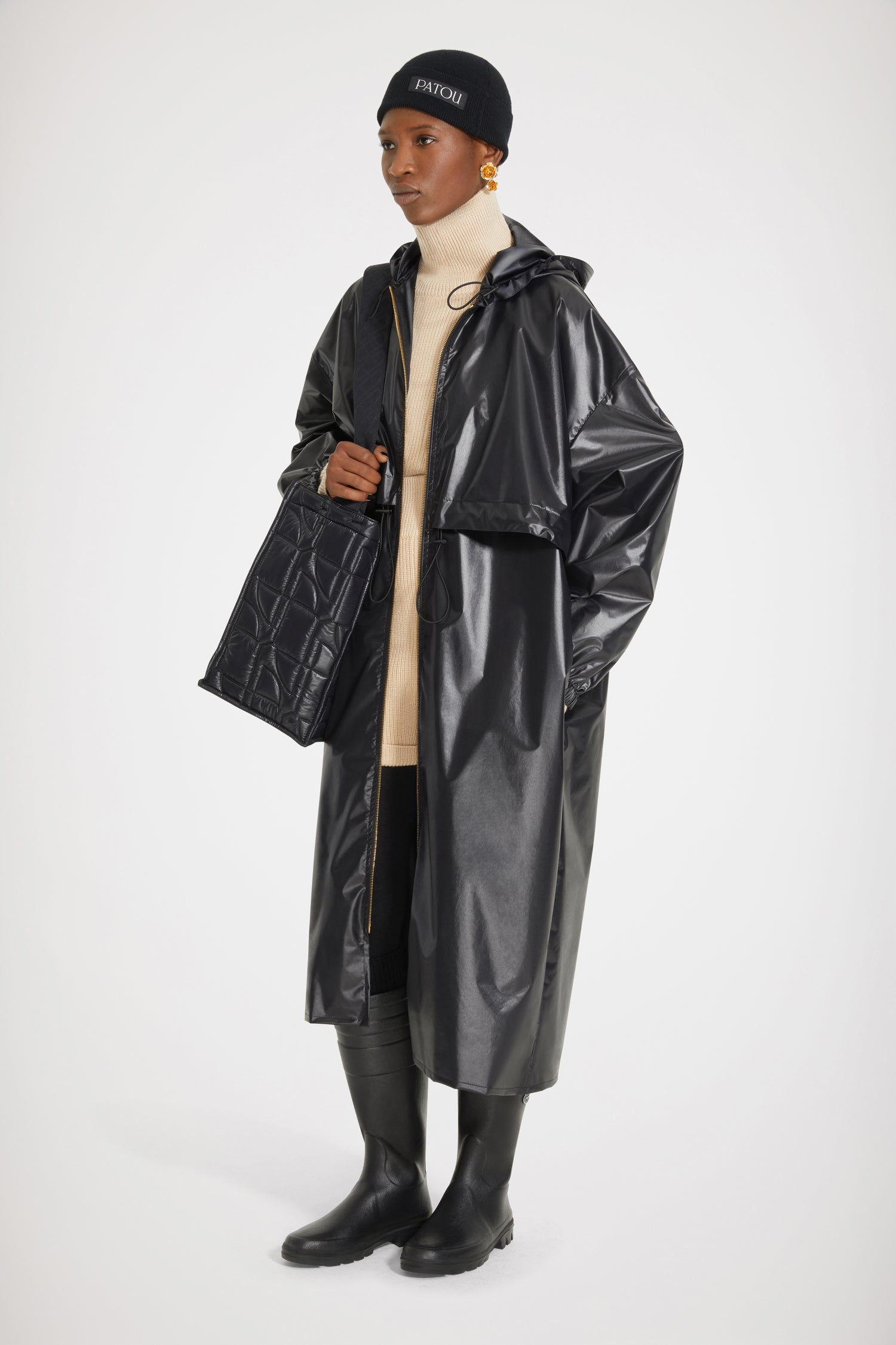Patou - Signature raincoat in water-repellent polyester - Black - Singing in the rain, dreaming in Patou.Black polyester blend raincoat. Lightweight water-repellent design. Hooded collar with drawstring. Two-way gold-tone zip with black JP pullers inspired by a heritage keyring from the Jean Patou archive. Storm flap with adjustable drawstring. Elasticated cuffs. Loose fit (select one size down for a fitted look).