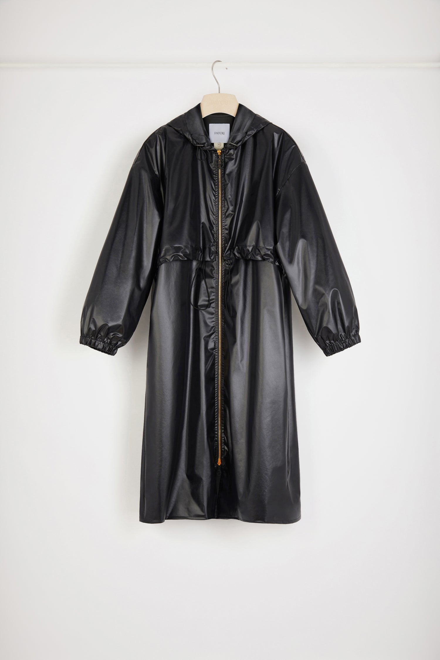 Patou - Signature raincoat in water-repellent polyester - Black - Singing in the rain, dreaming in Patou.Black polyester blend raincoat. Lightweight water-repellent design. Hooded collar with drawstring. Two-way gold-tone zip with black JP pullers inspired by a heritage keyring from the Jean Patou archive. Storm flap with adjustable drawstring. Elasticated cuffs. Loose fit (select one size down for a fitted look).