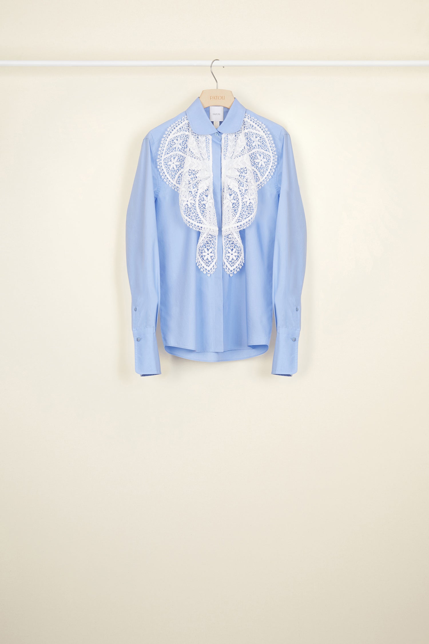 Patou - Lace bib shirt - Blue - The sheer seduction of guipure lace.Light blue cotton poplin shirt with white floral lace bib at the front. Classic shirt collar and concealed button fastening. Buttoned cuffs.